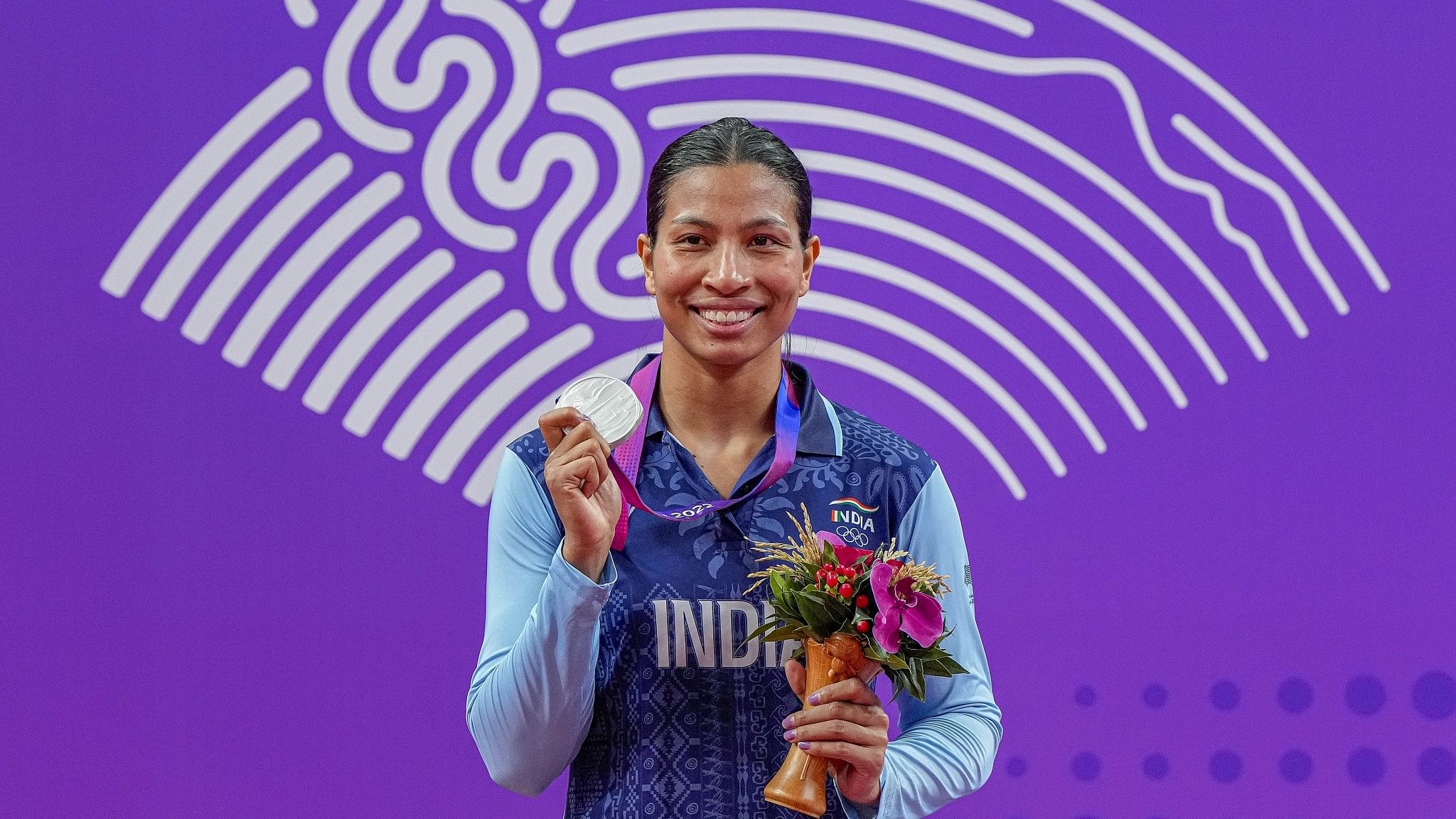 <div class="paragraphs"><p>Silver medallist India's Lovlina Borgohain poses for photos during the presentation ceremony of women's 66-75kg category boxing event at the 19th Asian Games, in Hangzhou, China.</p><p> </p></div>