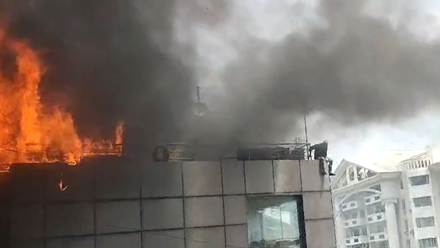 <div class="paragraphs"><p>The cafe's chef is seen jumping off the fourth floor of the building to escape the fire. The 29-year-old is said to be critical with multiple injuries. </p></div>