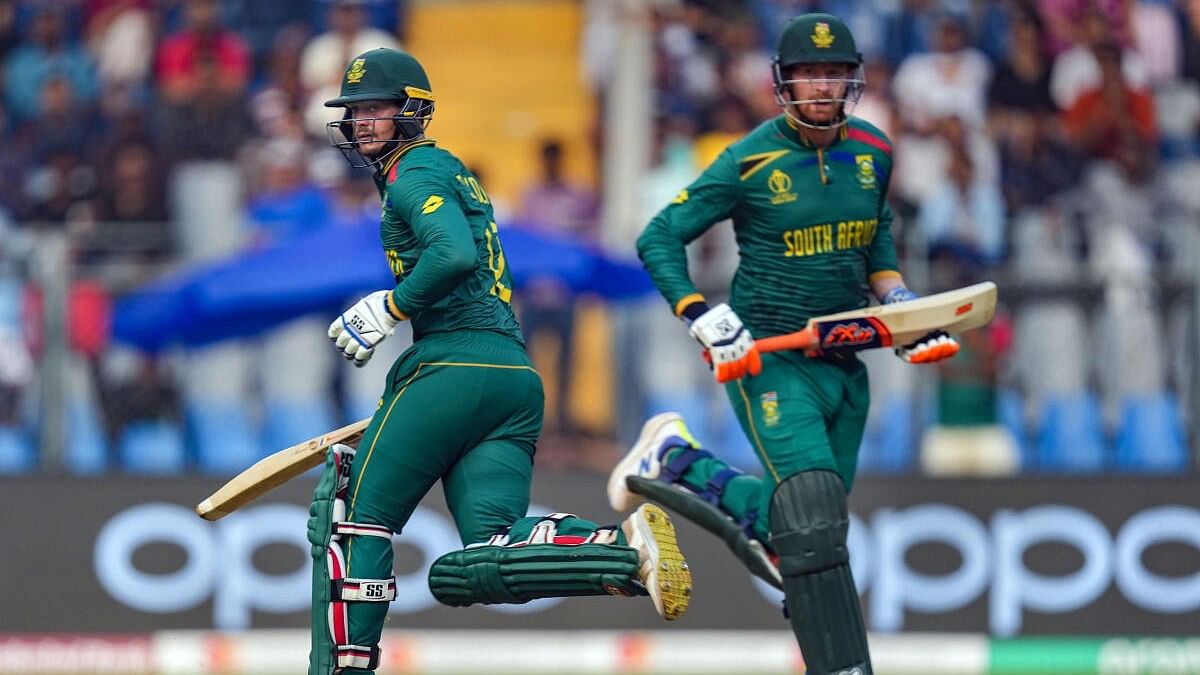 <div class="paragraphs"><p>South Africa’s Quinton de Kock and Heinrich Klaasen run between the wickets during the ICC Men’s Cricket World Cup 2023 match between Bangladesh and South Africa, in Mumbai, Tuesday, Oct. 24, 2023.</p></div>