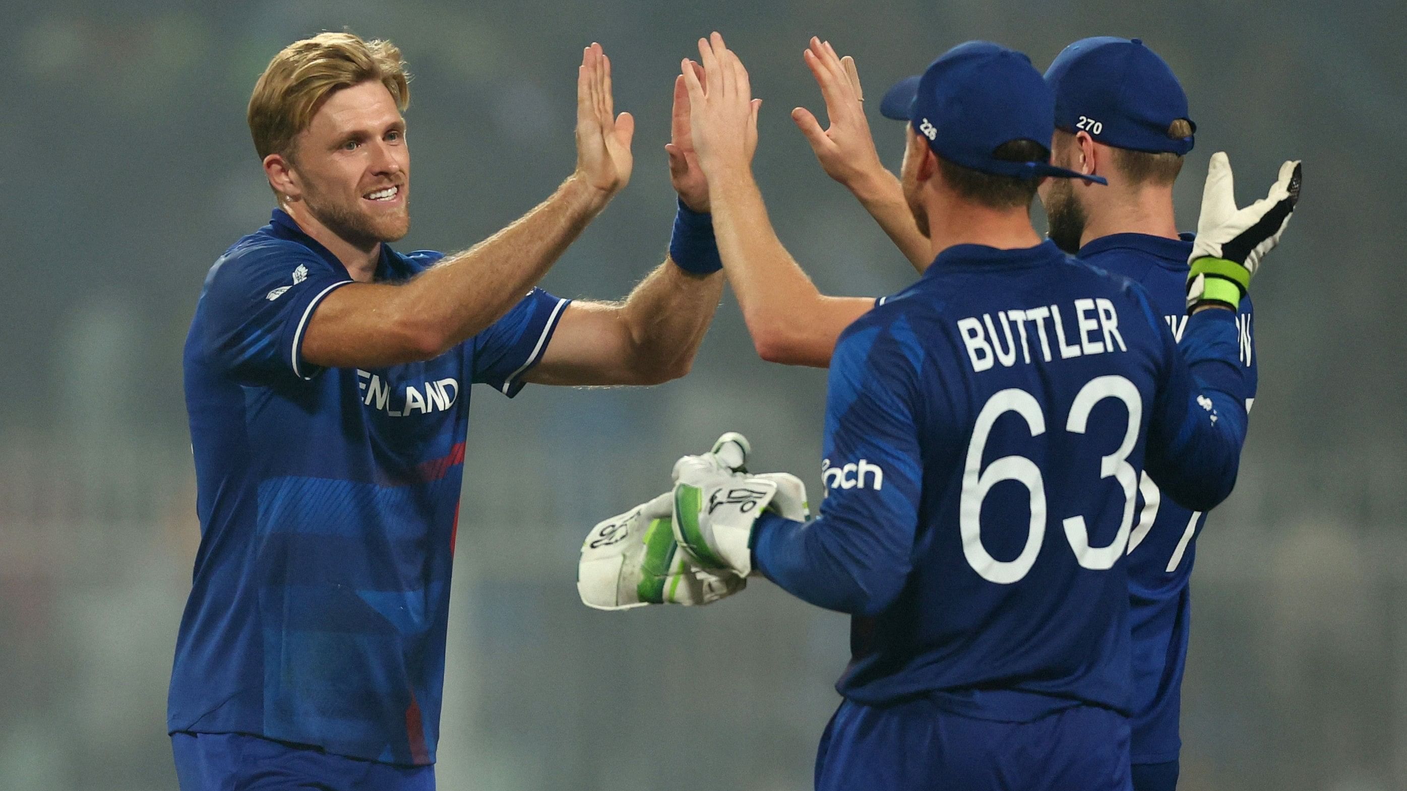 <div class="paragraphs"><p> England's David Willey celebrates with Jos Buttler after taking the wicket of Pakistan's Salman Ali Agha.</p></div>