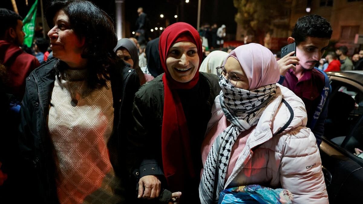 <div class="paragraphs"><p>People react as Palestinian prisoners leave after being released from the Israeli military prison, Ofer, amid a hostages-prisoners swap deal between Hamas and Israel, near Ramallah in the Israeli-occupied West Bank November 26, 2023.</p></div>