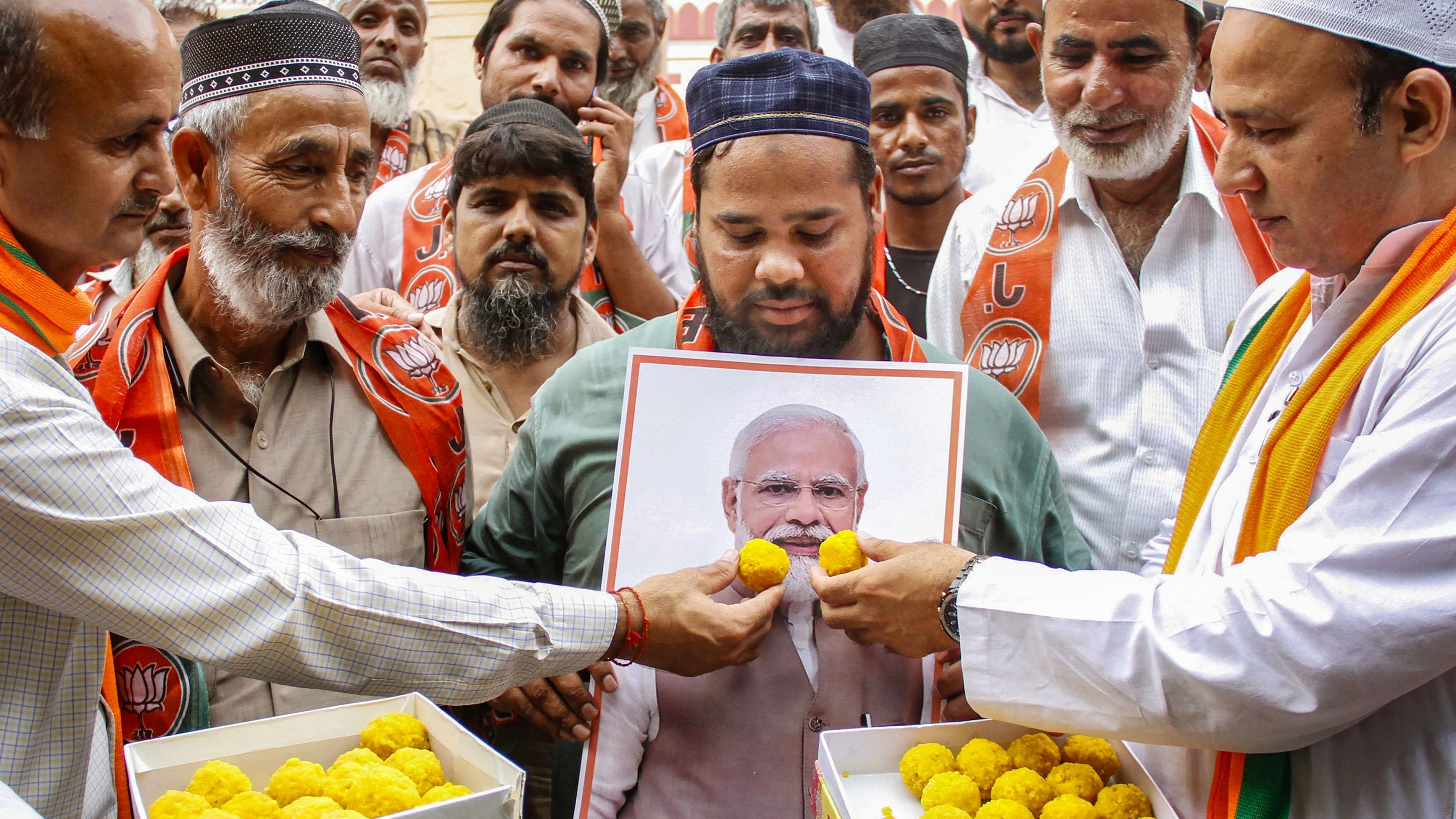 <div class="paragraphs"><p>BJP members with Muslim community people celebrate Prime Minister Narendra Modi's birthday at Jama Masjid.</p></div>