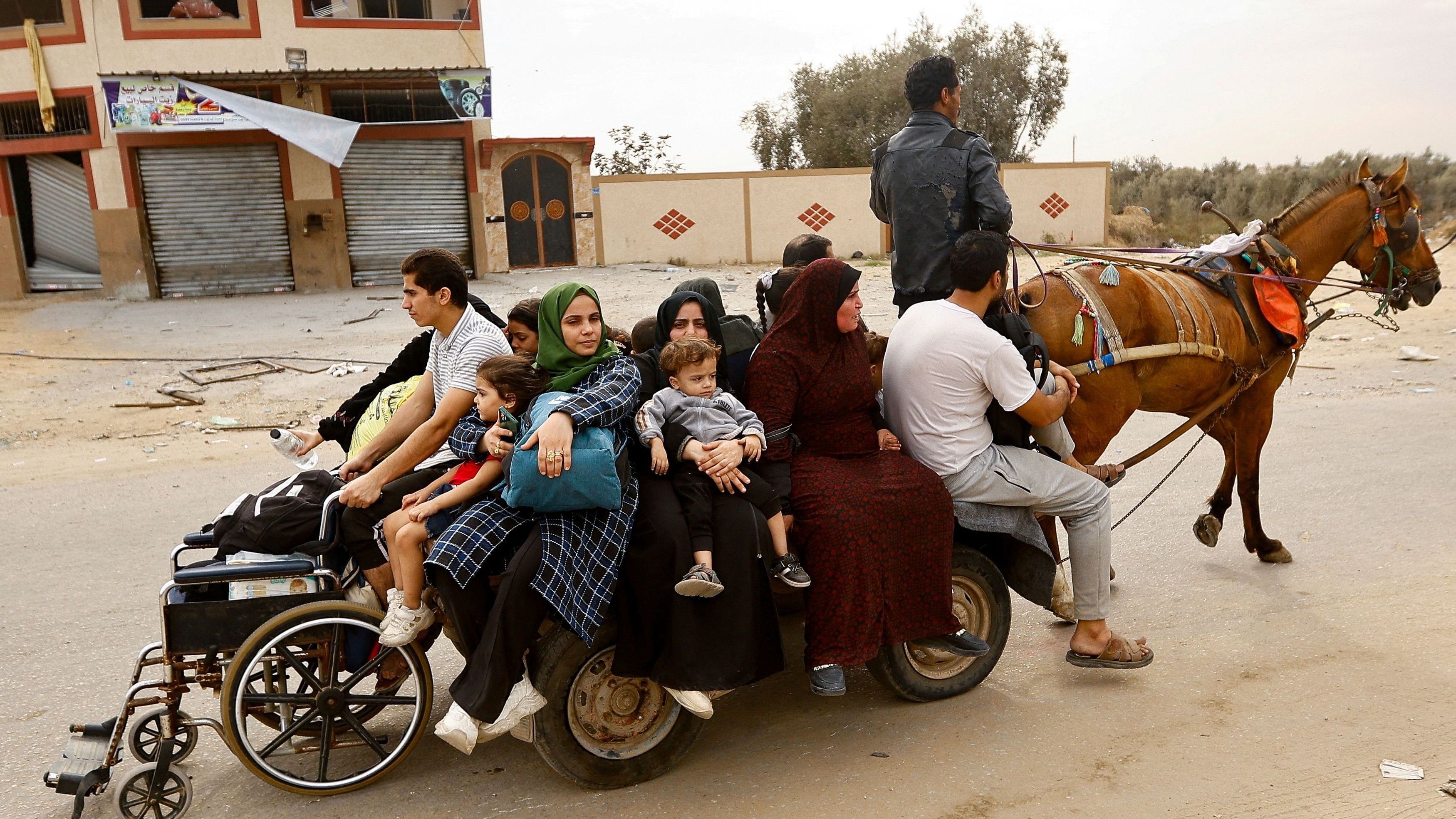 <div class="paragraphs"><p>Palestinians sit as they are pulled by a horse, amid the ongoing conflict between Israel and Palestinian Islamist group Hamas, in Khan Younis in the southern Gaza Strip November 15, 2023. </p></div>