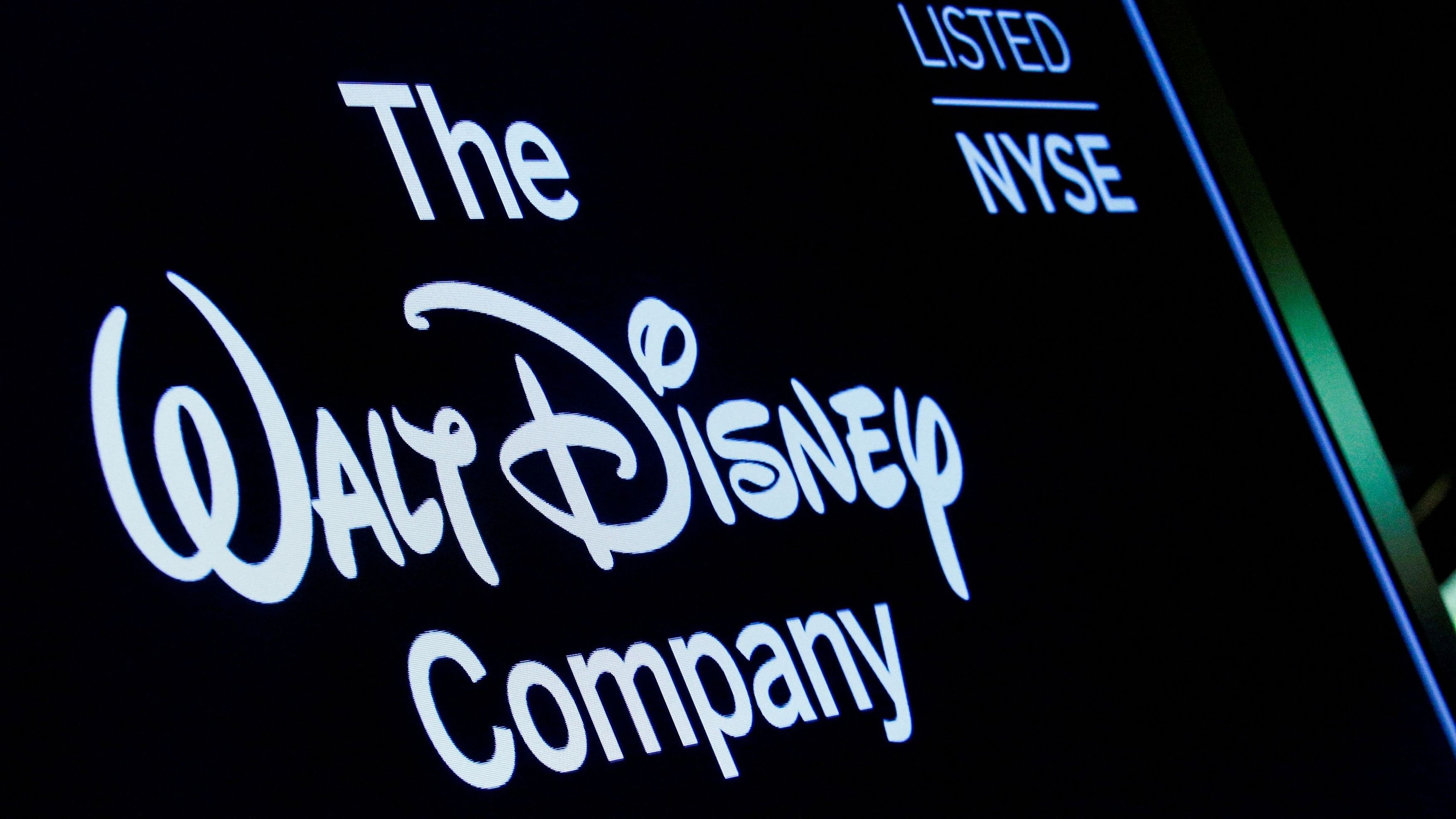 <div class="paragraphs"><p>A screen shows the logo and a ticker symbol for The Walt Disney Company.</p></div>