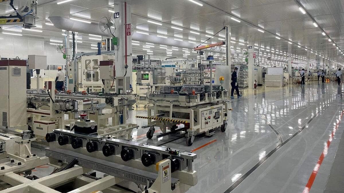 <div class="paragraphs"><p>Employees work inside a Toyota Kirloskar Auto Parts factory where the company builds E-Drives for its hybrid cars in Bidadi in the southern state of Karnataka.&nbsp;</p></div>