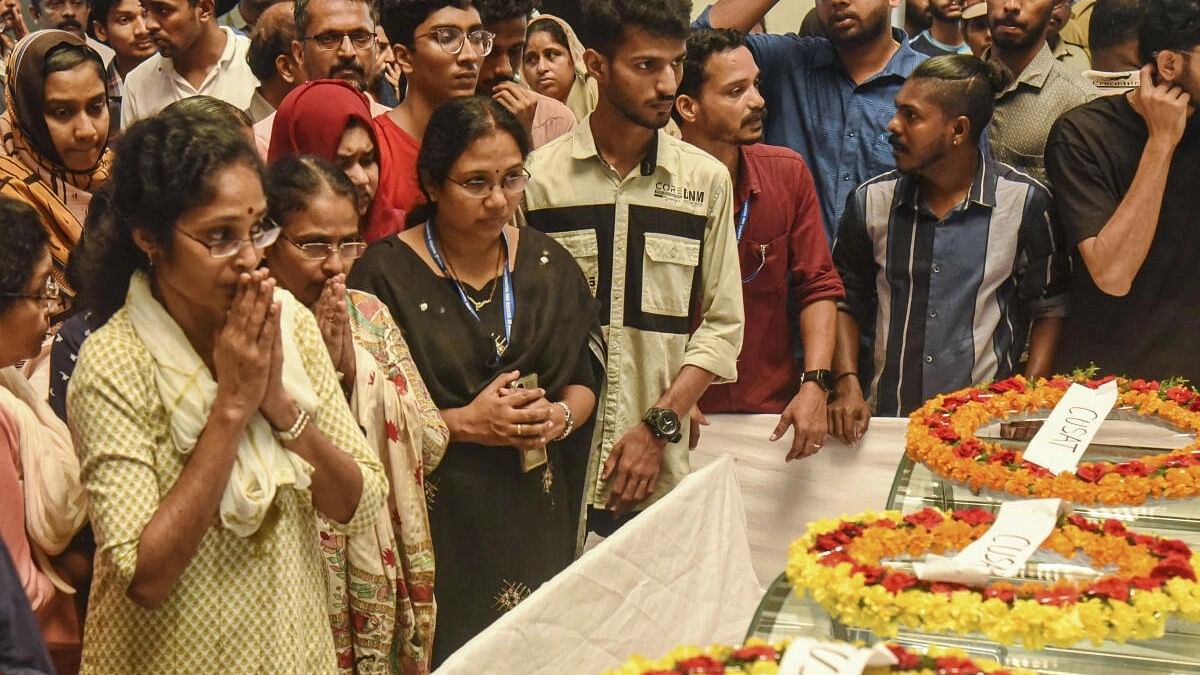 <div class="paragraphs"><p>People pay last respect to the mortal remains of three students who died after a stampede during the annual festival of Cochin University of Science and Technology (CUSAT).</p></div>
