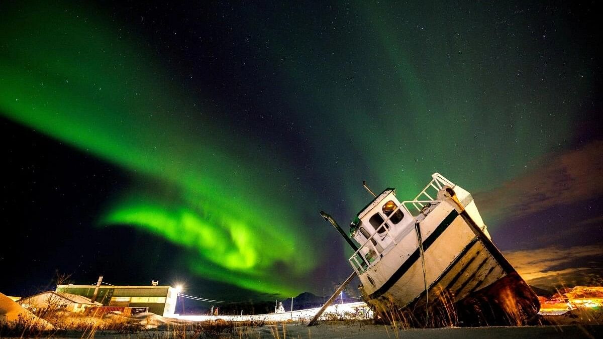 <div class="paragraphs"><p>Northern Lights, also called Aurora Borealis, illuminate the night sky over a boat on the shore in Sommaroy, Norway November 19, 2023. </p></div>