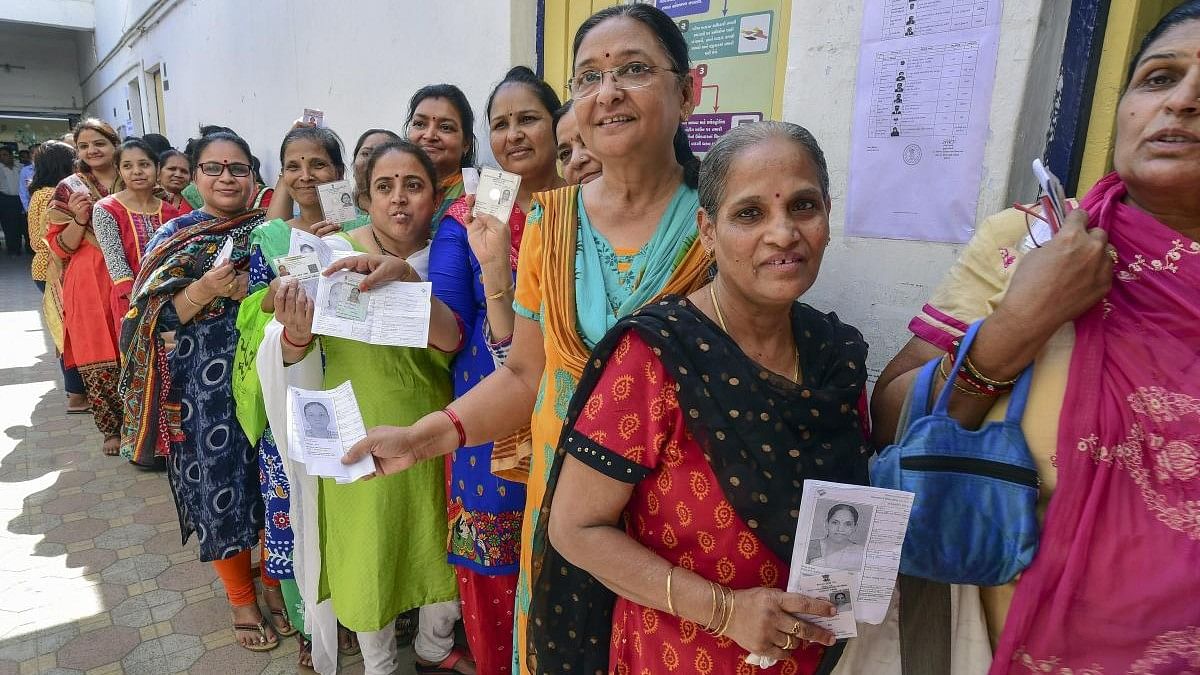 <div class="paragraphs"><p>Women voters queue up to cast their votes at a polling station.&nbsp;</p></div>