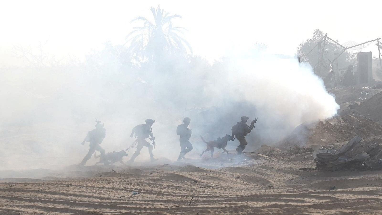 <div class="paragraphs"><p>Israeli soldiers take a position inside the Gaza Strip, amid the ongoing ground operation of the Israeli army against Palestinian Islamist group Hamas, according to the Israeli Defense Forces (IDF), in this handout picture obtained by Reuters on November 11, 2023. </p></div>