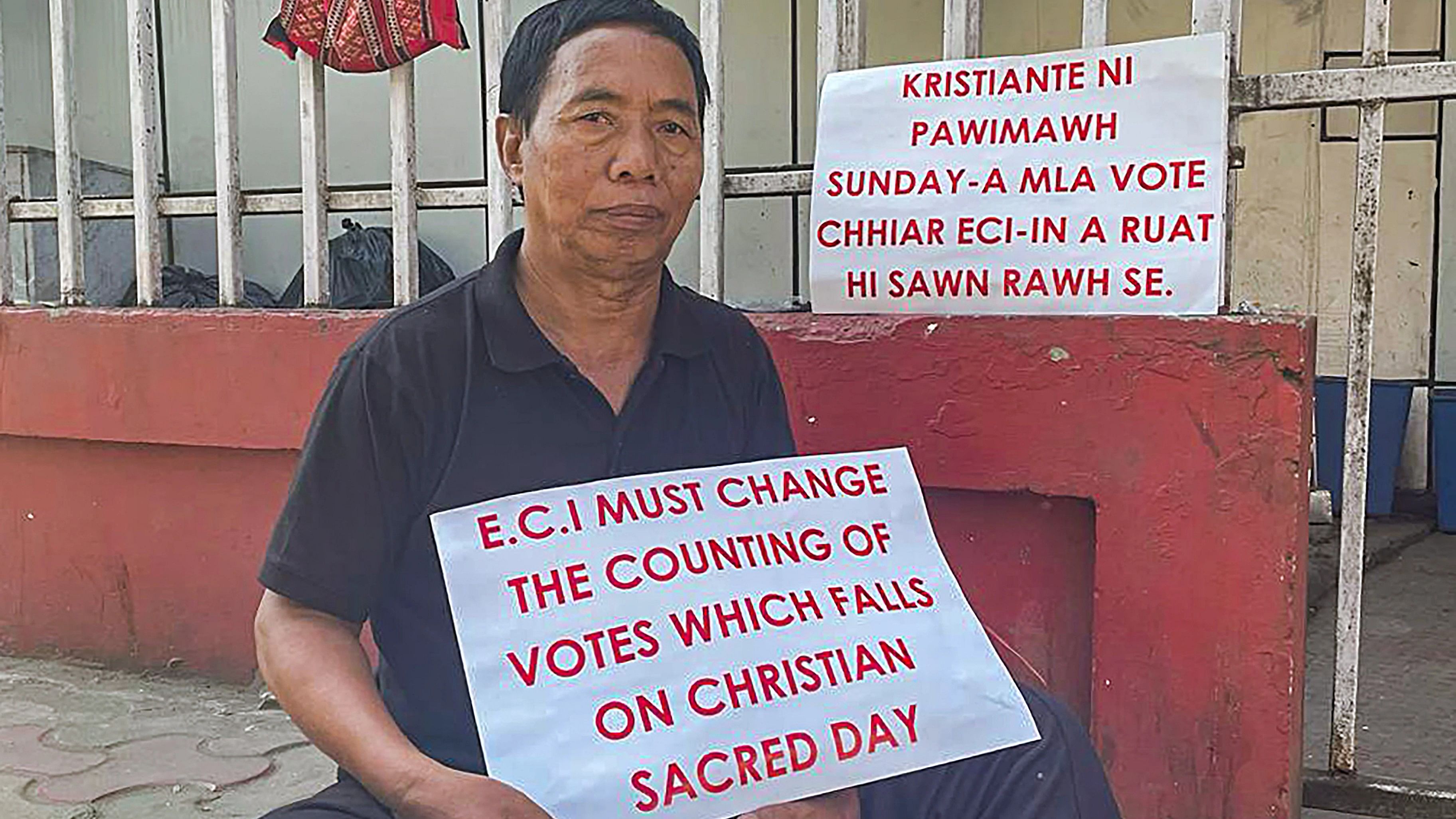 <div class="paragraphs"><p> Lalbiakthanga, a social activist known as 'walkathon man', sits on a hunger strike demanding to reschedule the day of the counting of votes on the day of voting for Mizoram Assembly elections, in Aizawl.</p></div>