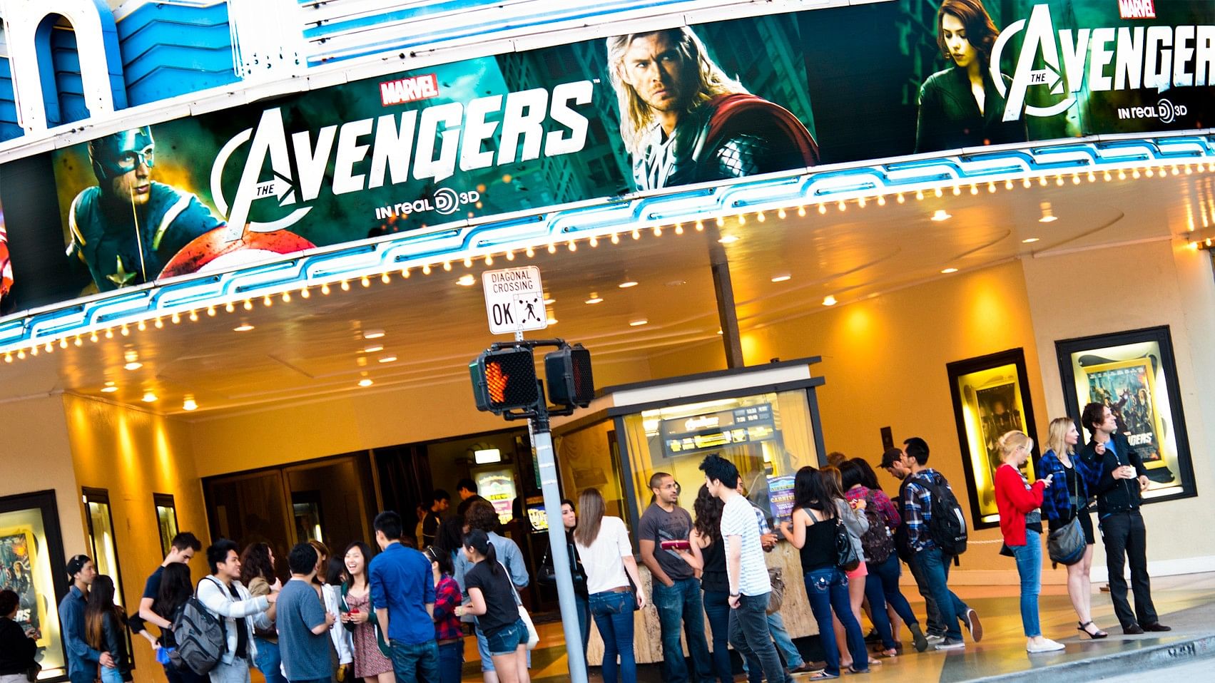 <div class="paragraphs"><p>People wait in queue for a screening of 'The Avengers'.</p></div>