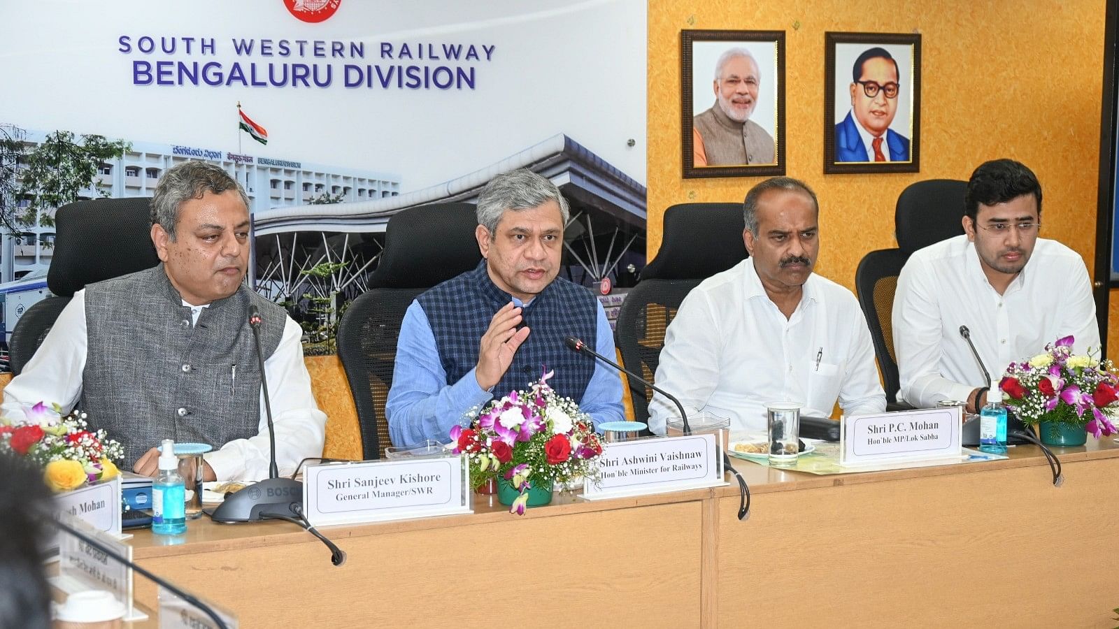 <div class="paragraphs"><p>Union Minister of Railways Ashwini Vaishnaw chairs a review meeting of Karnataka-related railway projects in Bengaluru on Monday. Sanjeev Kishore, General Manager, South Western Railway (SWR), and parliamentarians PC Mohan and LS Tejasvi Surya are seen. </p></div>