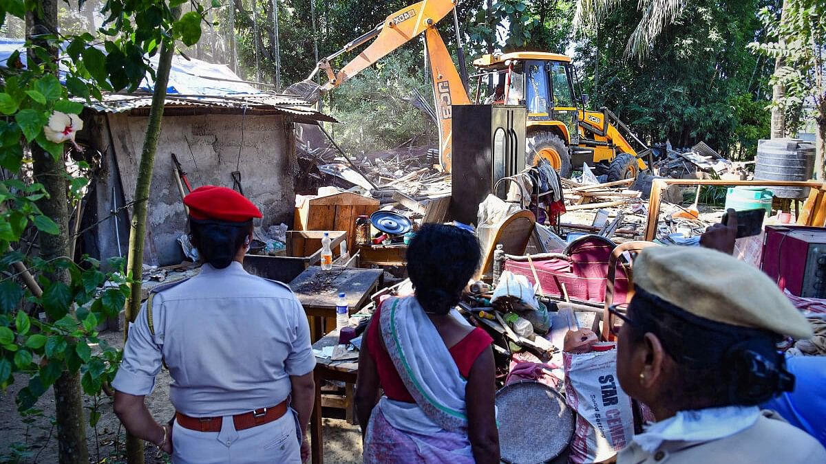 <div class="paragraphs"><p>A bulldozer being used to demolish illegal construction during an eviction drive at Paruwa Chariali, in Assam's Tezpur.&nbsp;</p></div>