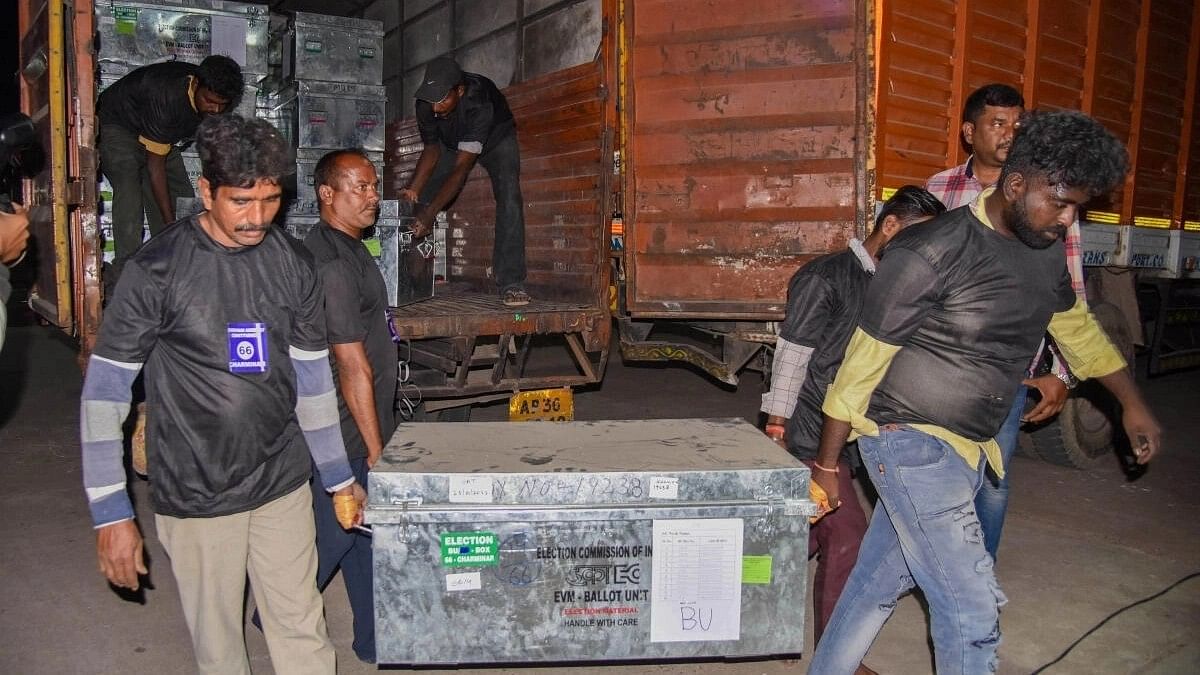 <div class="paragraphs"><p>Workers unload boxes containing EVMs from a truck at Charminar Assembly constituency strong room ahead of Telangana Assembly elections, in Hyderabad.</p></div>