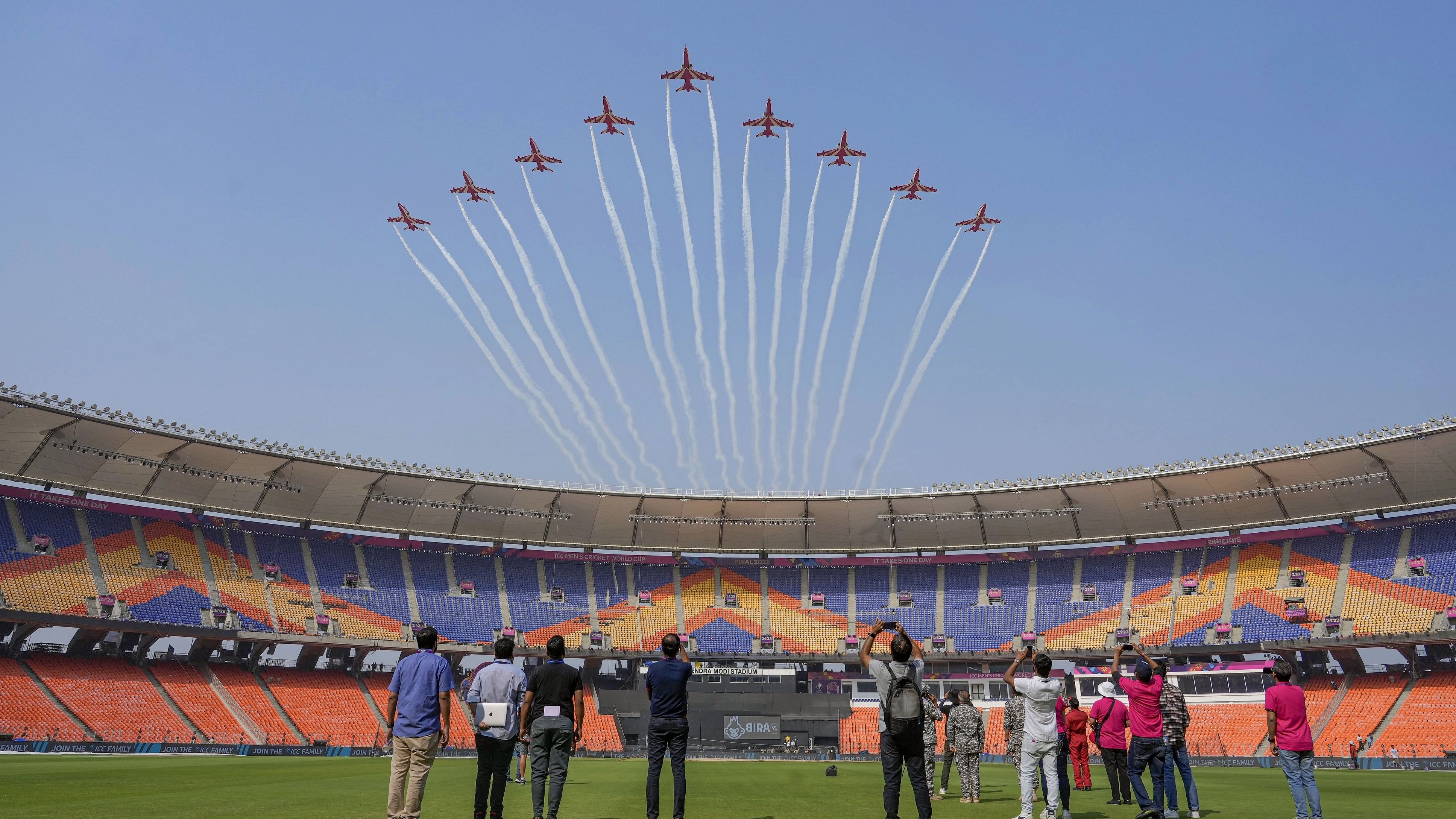 <div class="paragraphs"><p>Ahmedabad: Indian Air Forces (IAF) Surya Kiran Aerobatic Team flies past during rehearsal ahead of the ICC Mens Cricket World Cup 2023.</p></div>