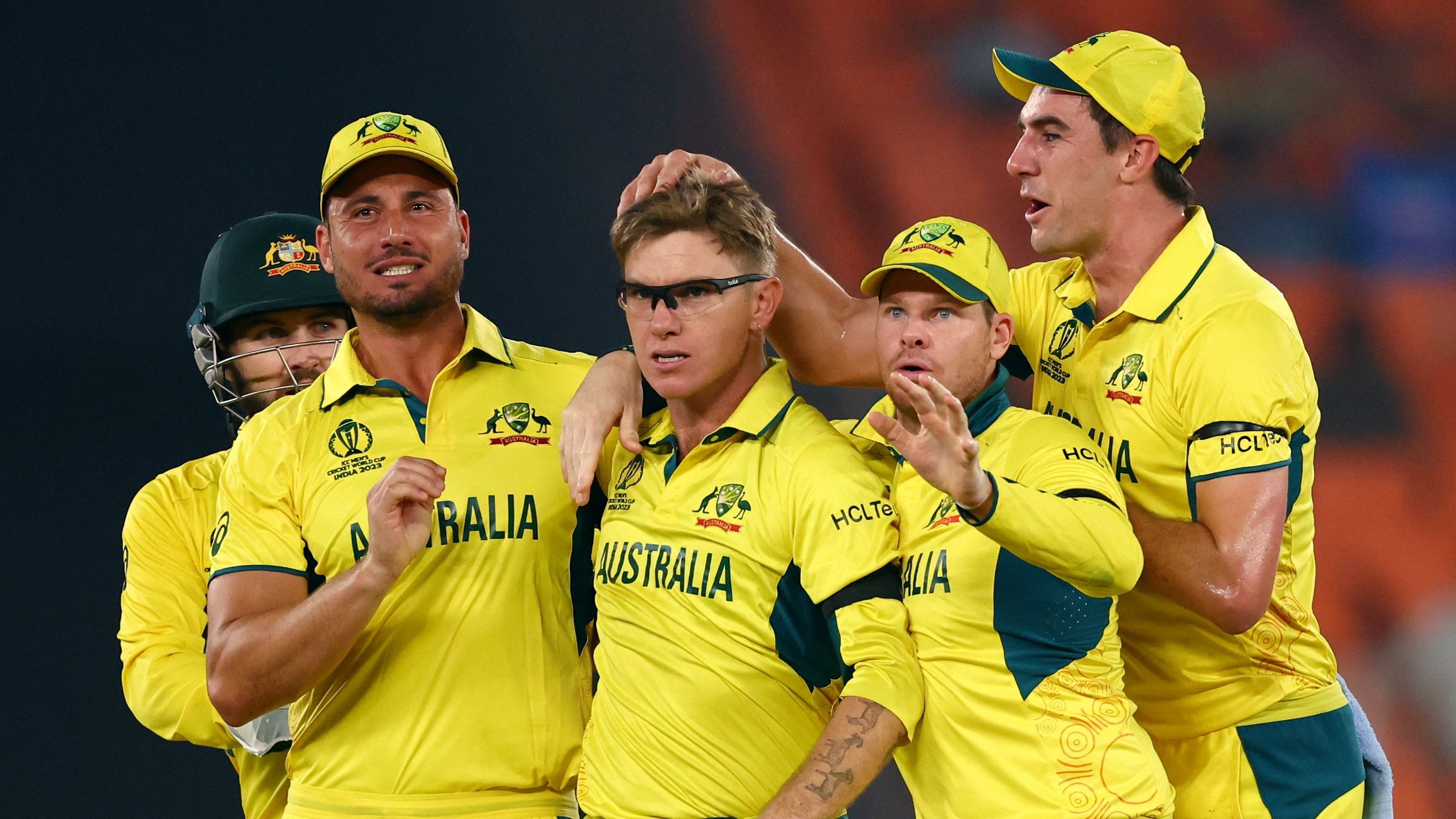 <div class="paragraphs"><p>Australia's Adam Zampa celebrates with Pat Cummins, Steve Smith and Marcus Stoinis after taking the wicket of England's Jos Buttler, caught by Cameron Green at the&nbsp;Narendra Modi Stadium, Ahmedabad.&nbsp;</p></div>