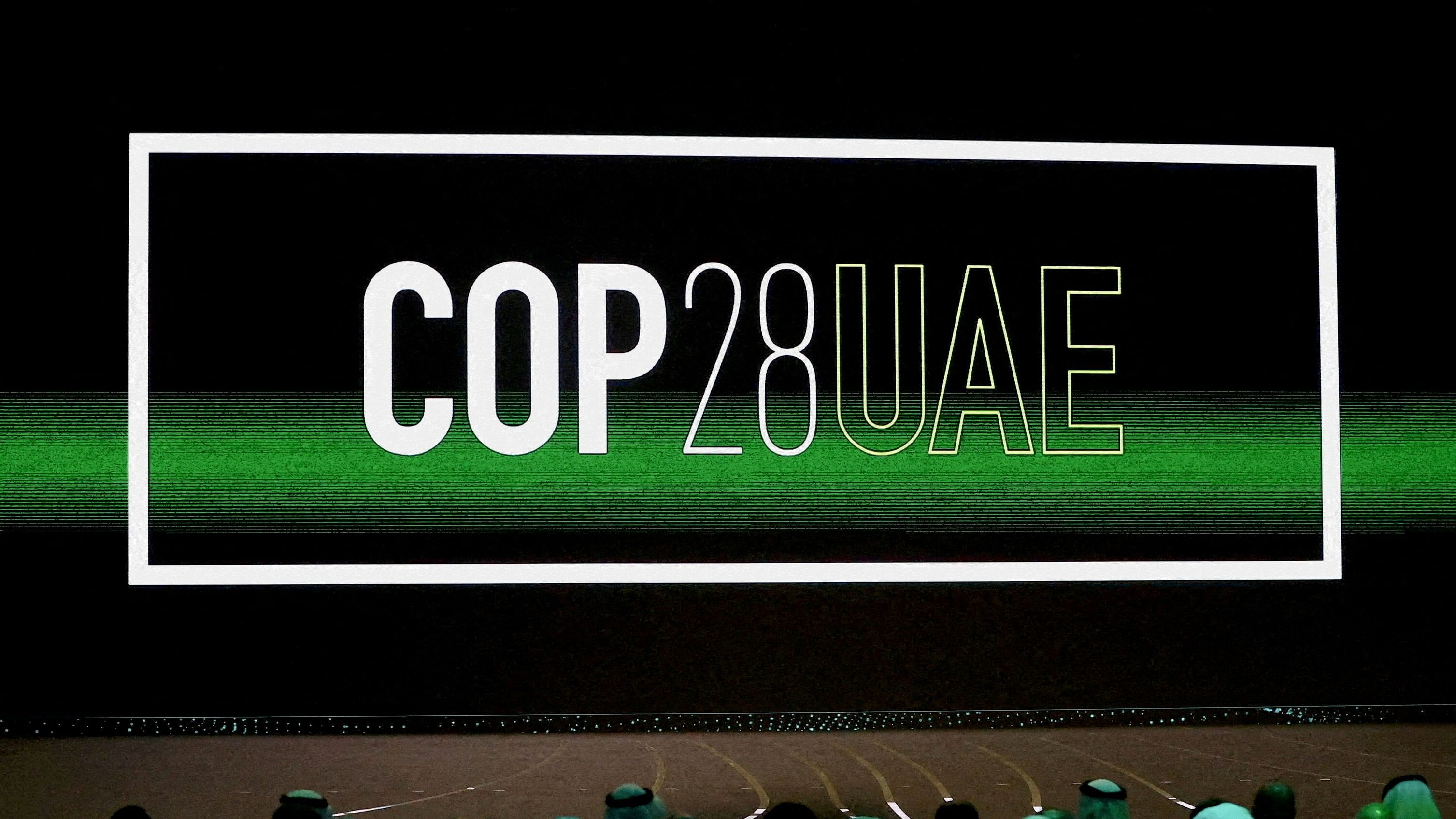 FILE PHOTO: 'COP28 UAE' logo is displayed on the screen during the opening ceremony of Abu Dhabi Sustainability Week  under the theme of 'United on Climate Action Toward COP28', in Abu Dhabi, UAE, January 16, 2023. REUTERS/Rula Rouhana/File Photo