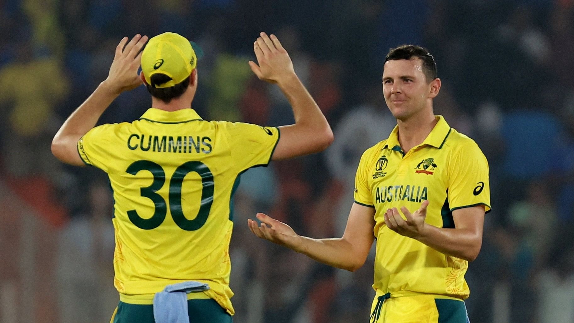 <div class="paragraphs"><p> Australia's Josh Hazlewood celebrates with Pat Cummins.</p></div>