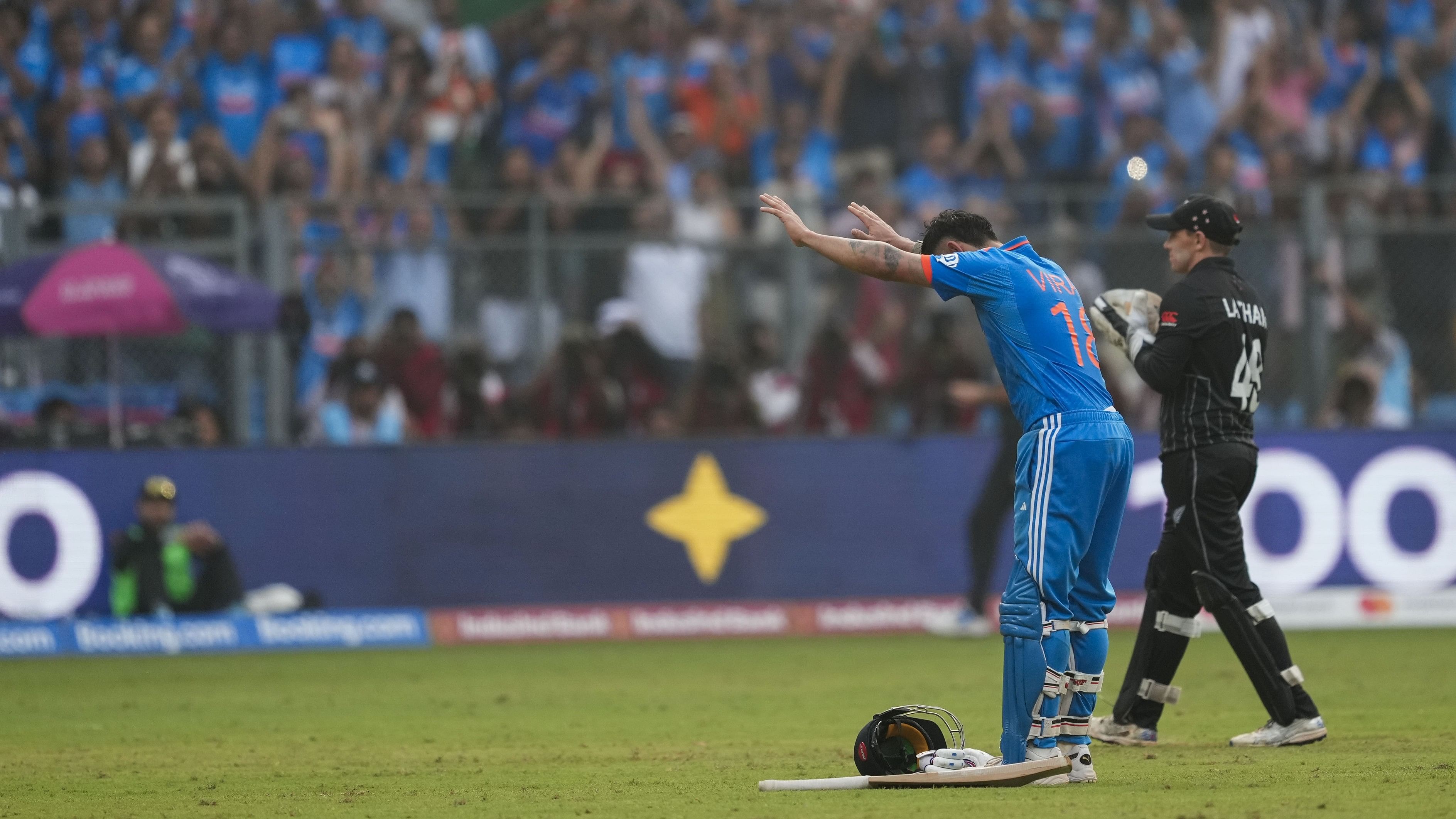 <div class="paragraphs"><p>Virat Kohli celebrates bows to Sachin Tendulkar in the stands after scoring his 50th ODI century to overhaul the latter's tally of 49 tons. </p></div>