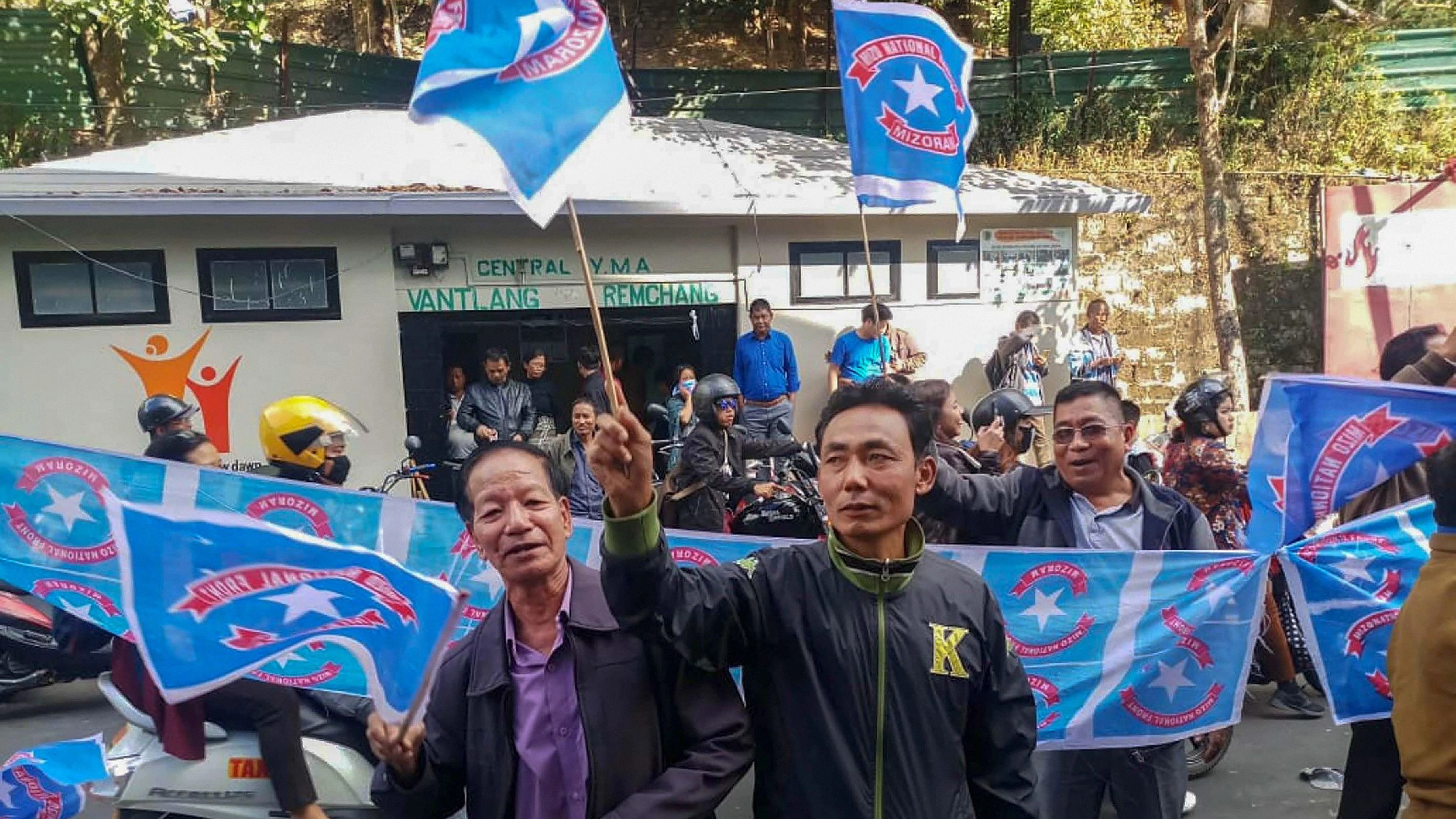 <div class="paragraphs"><p>File Photo: Mizo National Front (MNF) workers hold their party flag as they celebrate the party's victory in the 2018 Assembly elections, at the Party head office, in Aizawl, Tuesday, December 11, 2018.</p></div>