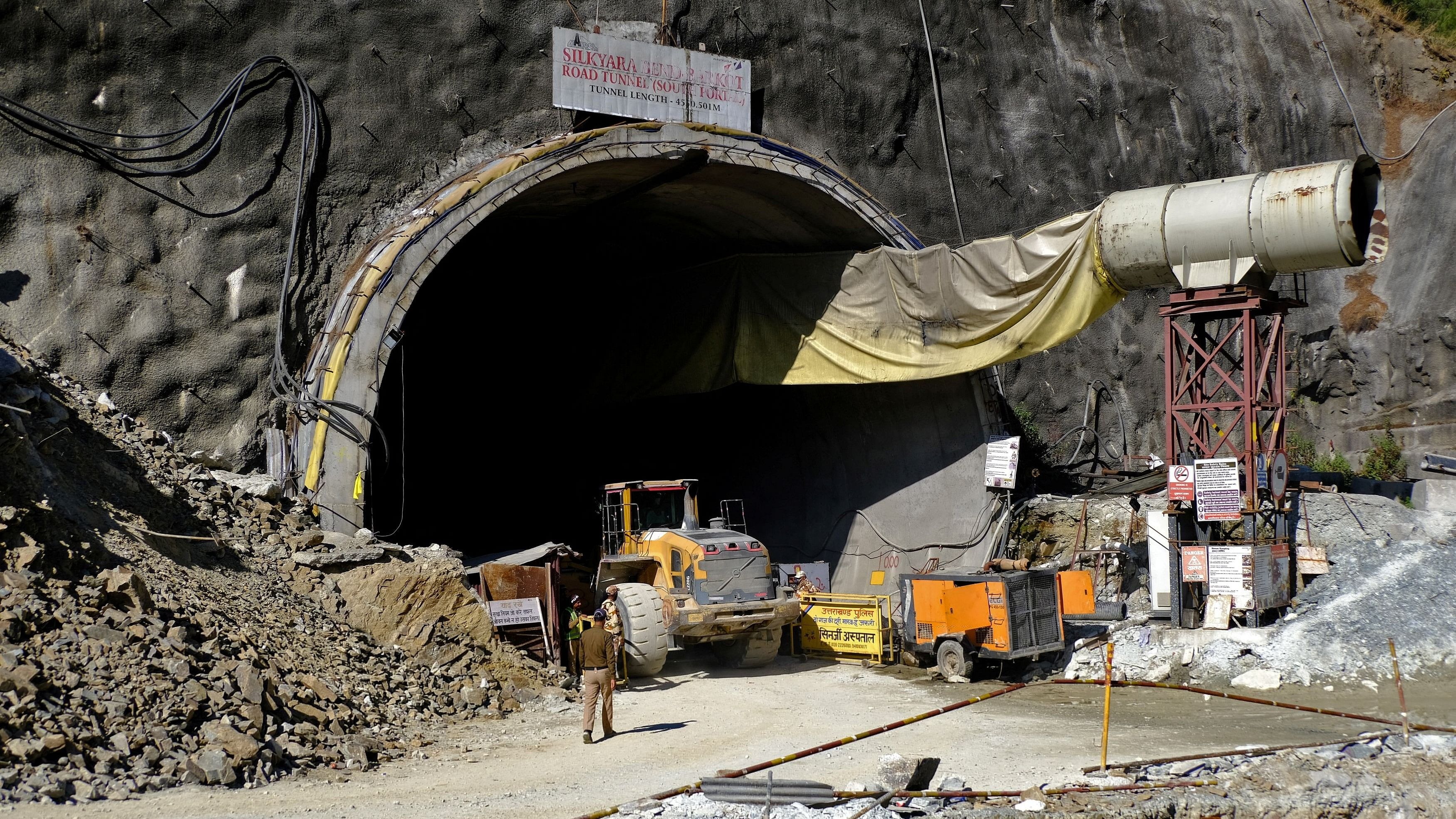 <div class="paragraphs"><p>Police officers stand at the entrance of a tunnel where 40 road workers are trapped after a portion of the tunnel collapsed in Uttarkashi in the northern state of Uttarakhand, India, November 15, 2023. </p></div>