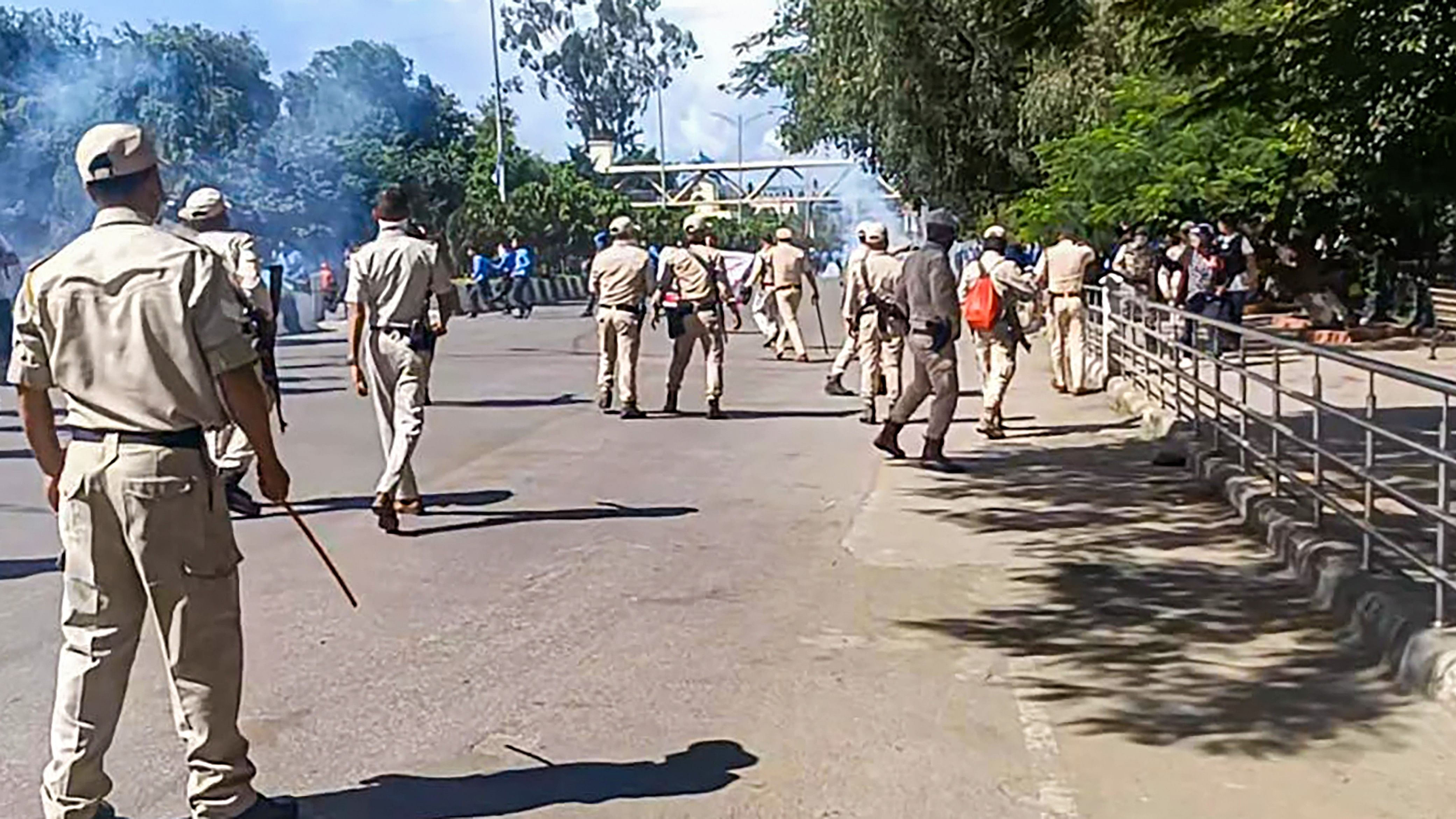 <div class="paragraphs"><p>Security personnel stand guard during a protest.&nbsp;</p></div>