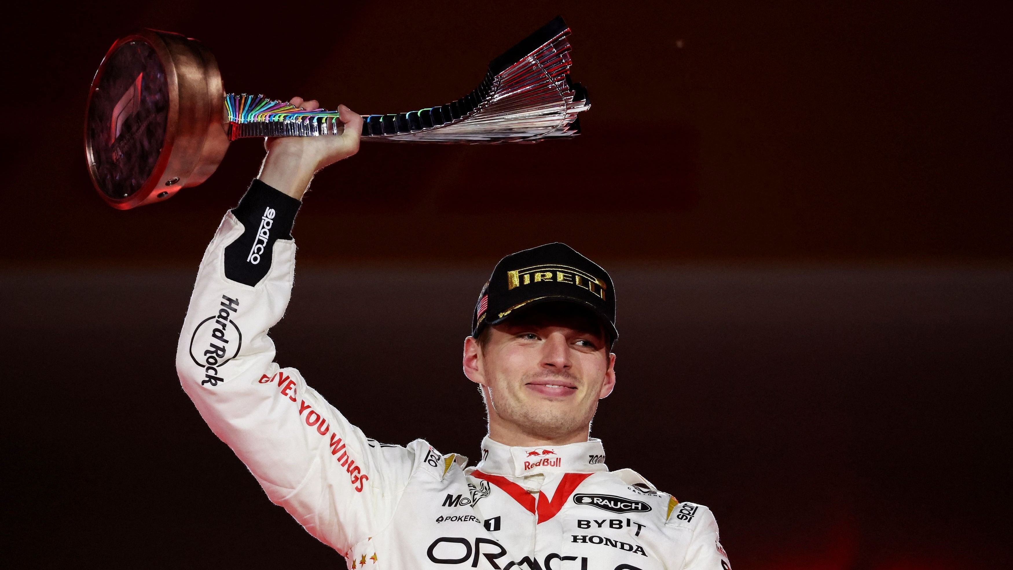 <div class="paragraphs"><p>First place Red Bull's Max Verstappen celebrates with the trophy on the podium.&nbsp;</p></div>