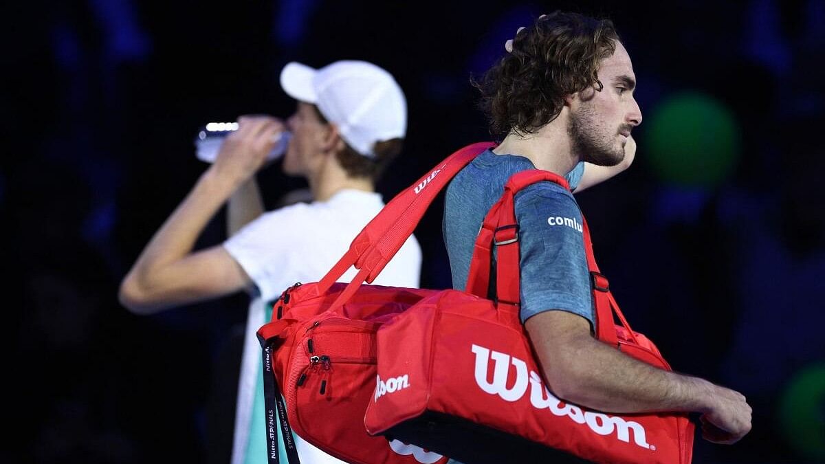 <div class="paragraphs"><p>Greece's Stefanos Tsitsipas looks dejected after losing his group stage match against Italy's Jannik Sinner</p></div>