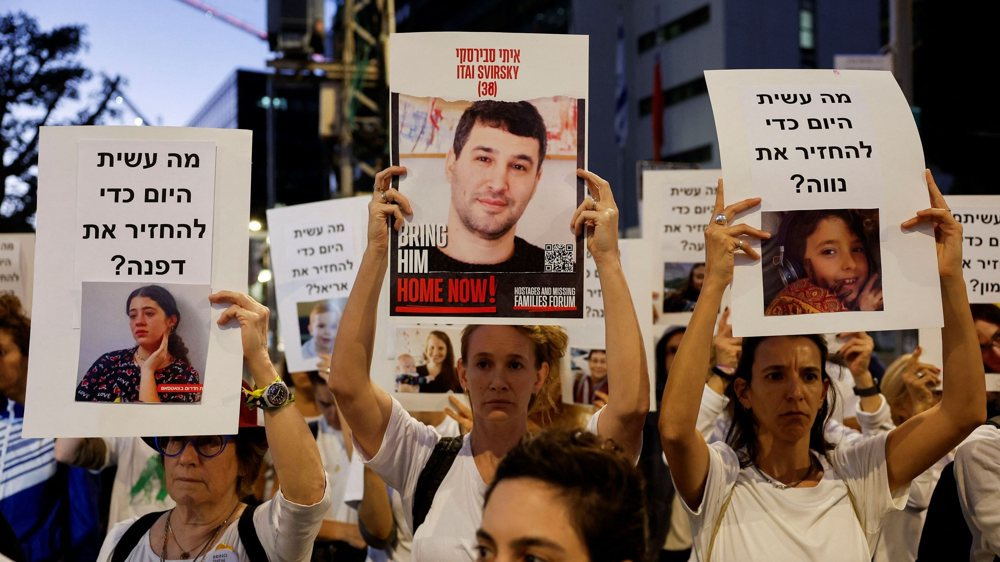 <div class="paragraphs"><p>Protesters hold signs demanding the liberation of hostages who are being held in the Gaza Strip after they were seized by Hamas gunmen on October 7, in Tel Aviv, Israel November 21, 2023. </p></div>