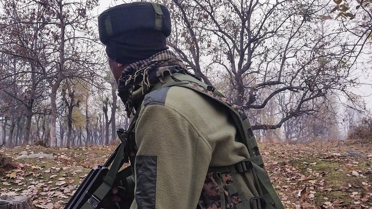 <div class="paragraphs"><p>A security official keeps vigil during an encounter with militants, in Kulgam, Thursday, Nov. 16, 2023.</p></div>