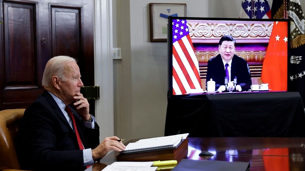 <div class="paragraphs"><p>File Photo: US President Joe Biden speaks virtually with Chinese leader Xi Jinping from the White House in Washington. </p></div>