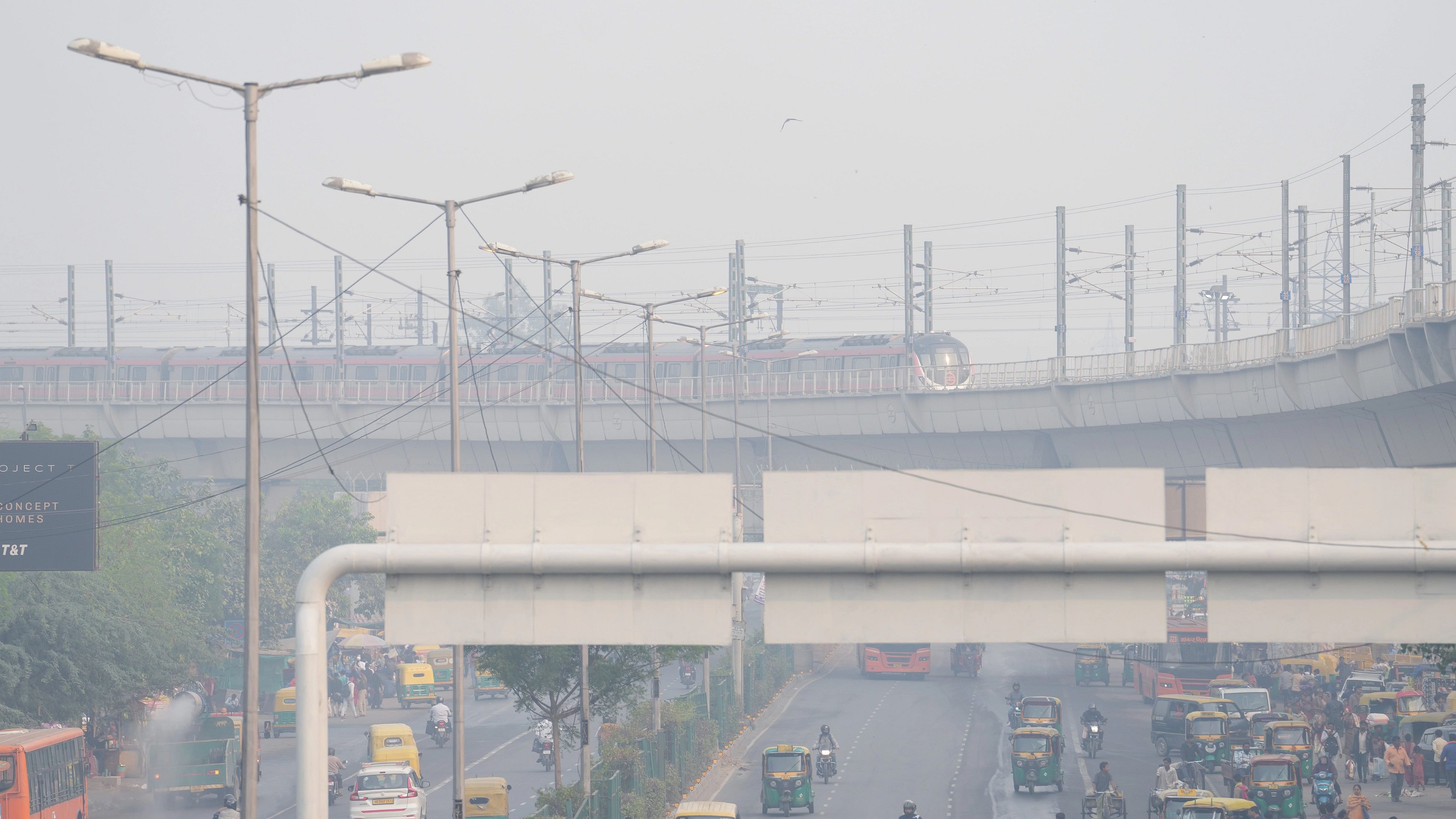 <div class="paragraphs"><p>A metro train runs on its track in New Delhi</p></div>