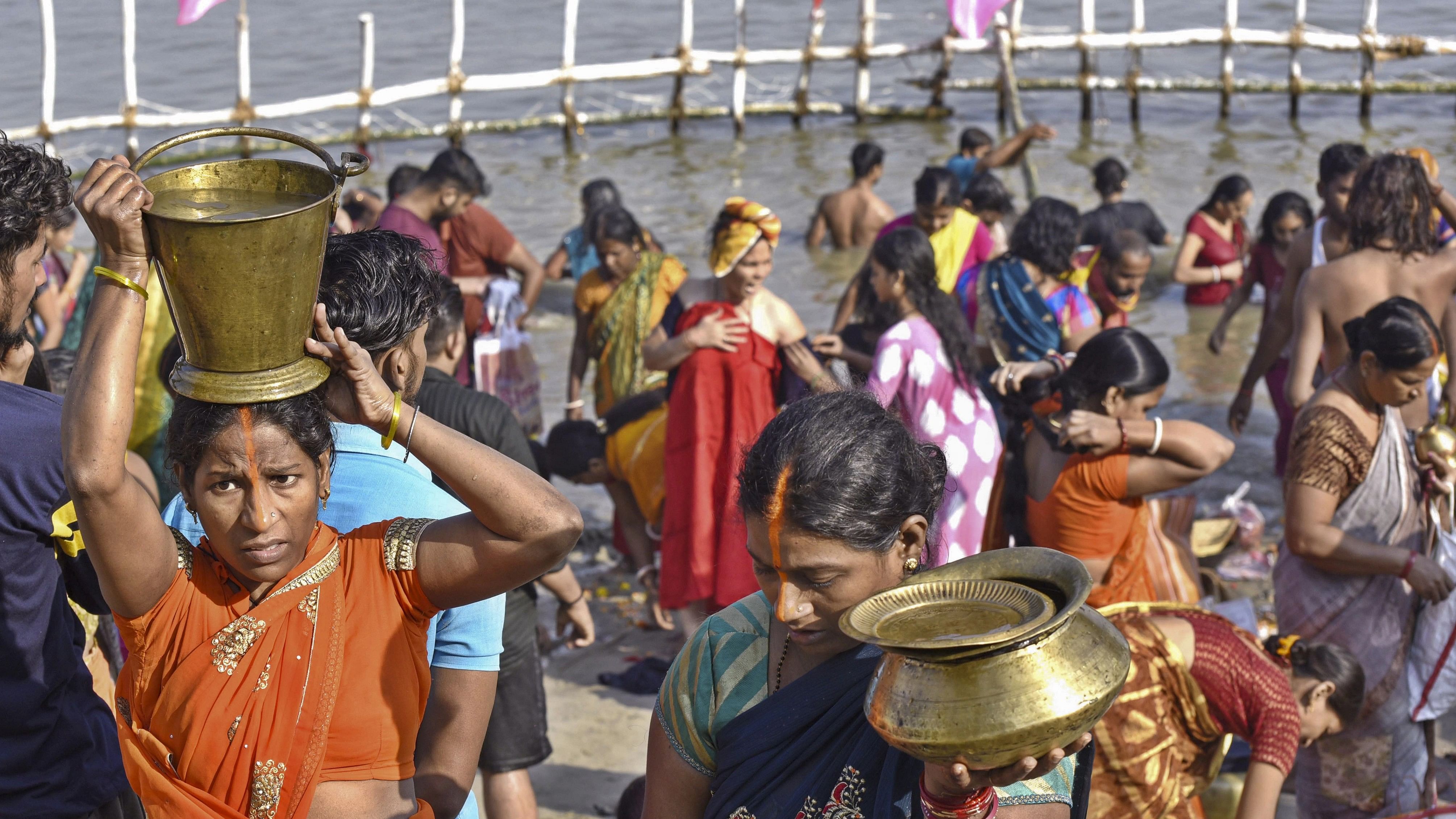 <div class="paragraphs"><p>Devotees performing rituals during 'Chhath Puja'.</p></div>