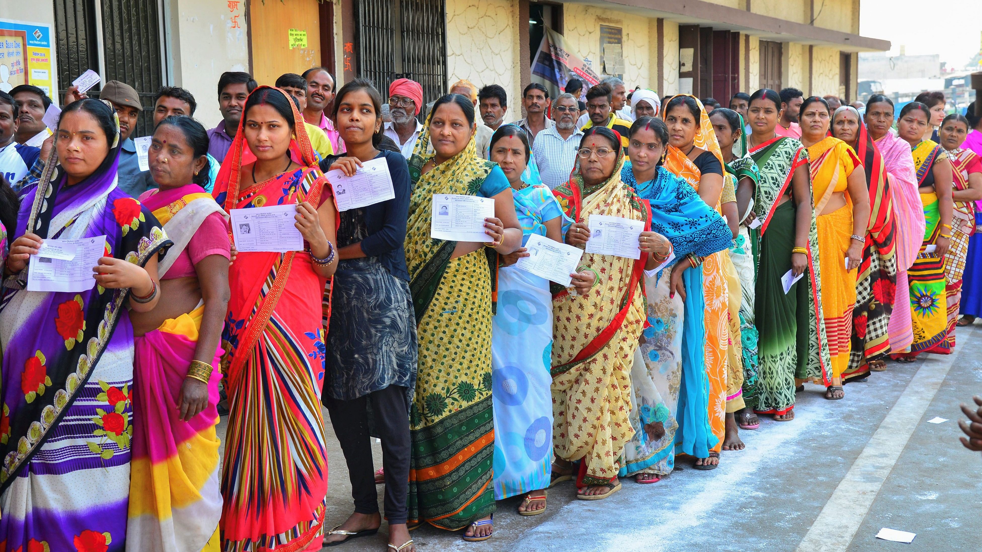 <div class="paragraphs"><p>Voters stand in a queue at a polling station.&nbsp;</p></div>