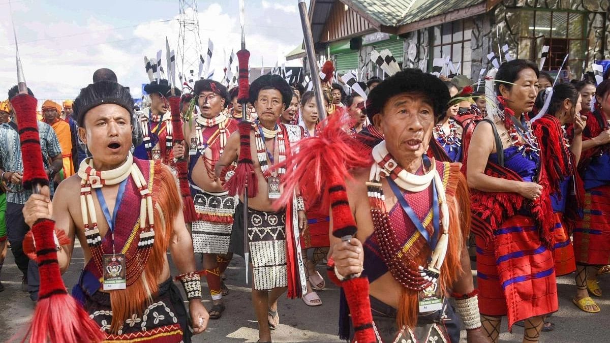 <div class="paragraphs"><p>File Photo: Naga tribal people in their traditional attire take part in a procession during inaugural day of the Hornbill festival at Kisama village on the outskirts of Kohima, Nagaland.</p></div>