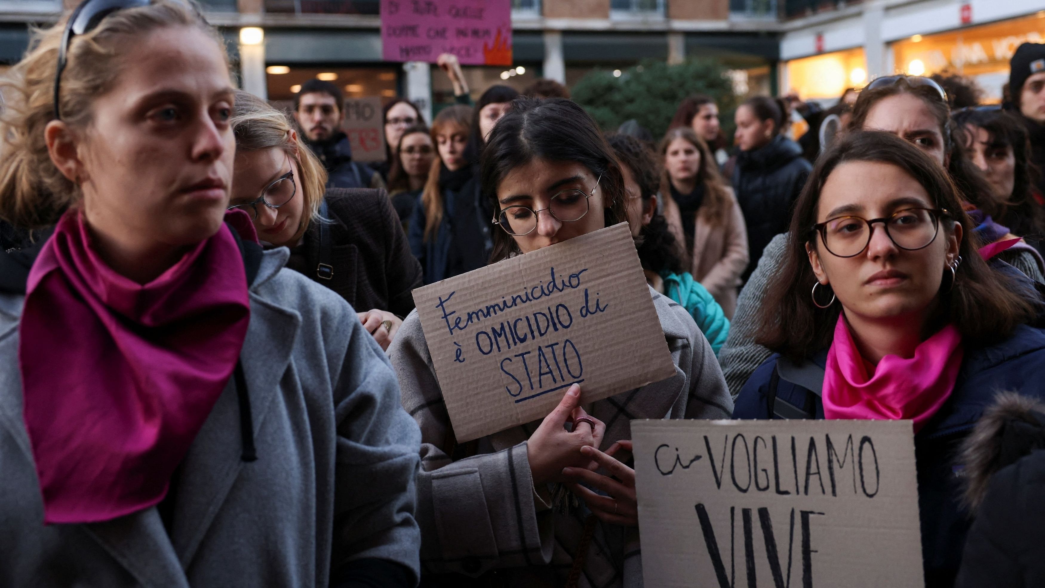 <div class="paragraphs"><p>Students hold banners reading "Femincide is a state murder" and "We want us alive" as they perform a flash mob to protest against feminicide and violence against women, following 22-years-old Giulia Cecchettin's murder, outside University of Milan, in Milan, Italy, November 22, 2023. </p></div>