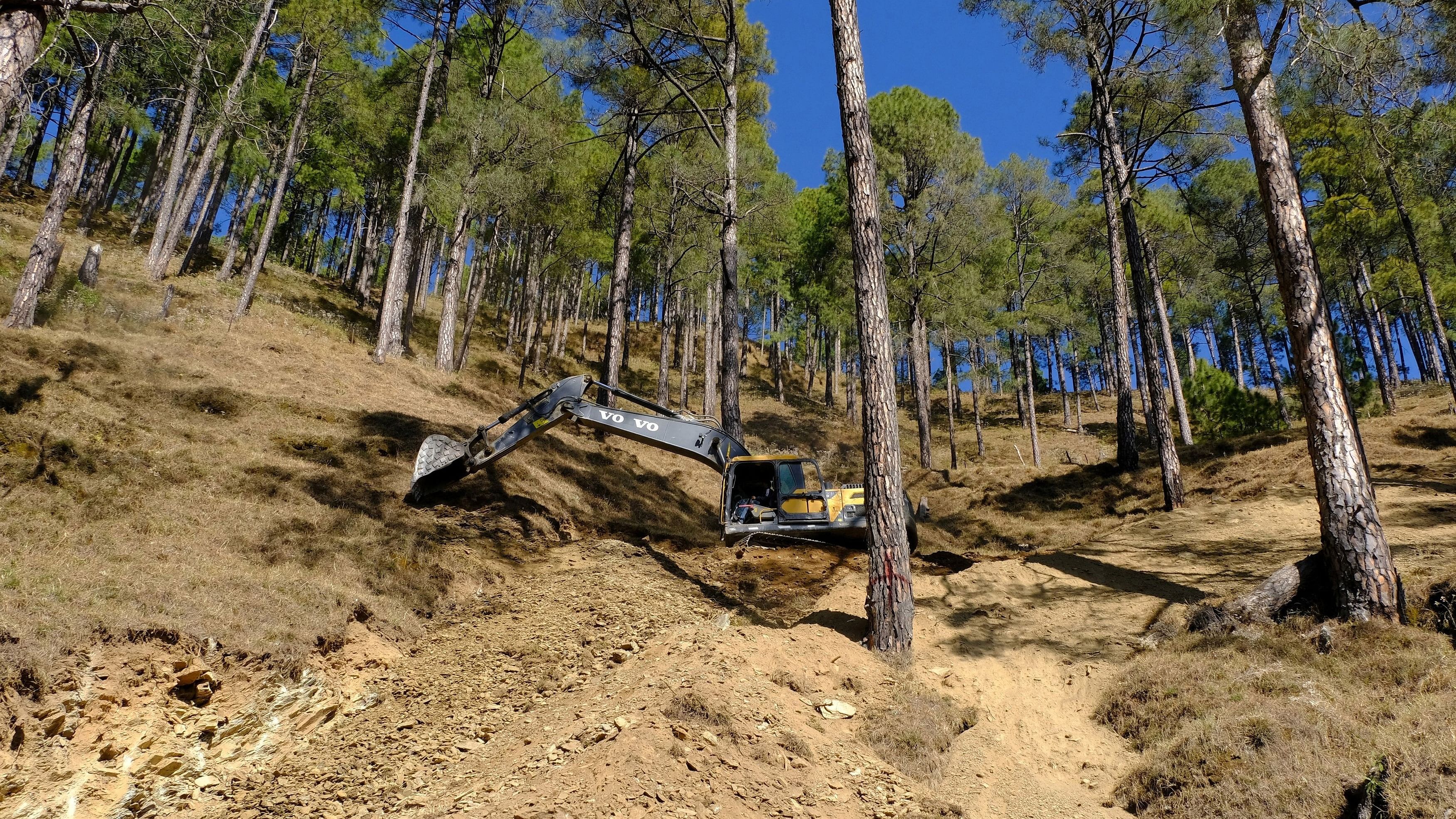 <div class="paragraphs"><p>A worker uses a digger to build a path in the hill as part of an alternate plan to reach to the workers trapped in a tunnel after a portion of the tunnel collapsed in Uttarkashi in the northern state of Uttarakhand, India, </p></div>