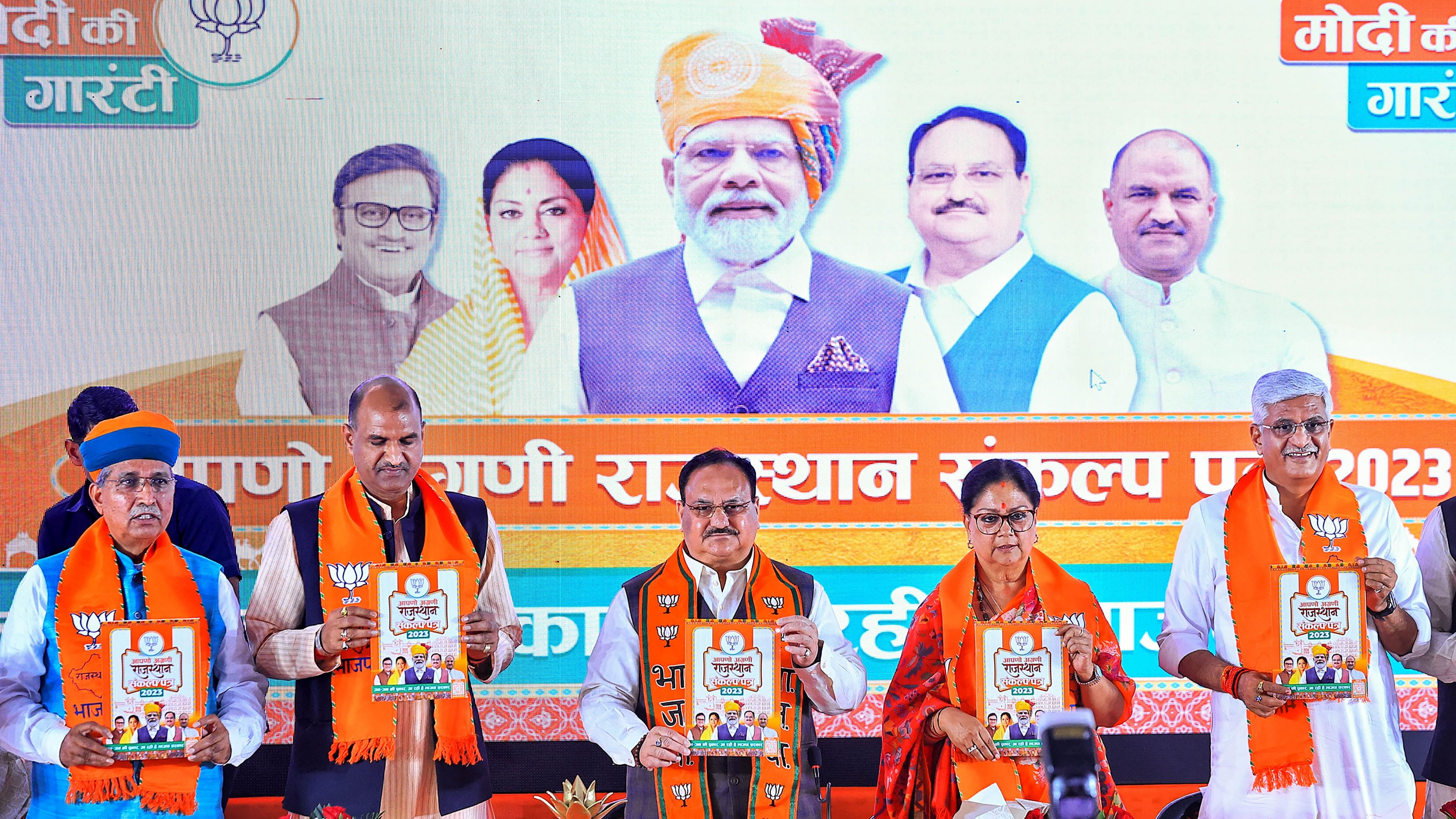 <div class="paragraphs"><p>BJP National President J P Nadda with former Rajasthan chief minister Vasundhara Raje and Union Ministers Arjun Ram Meghwal and Gajendra Singh Shekhawat during the launch of the party's manifesto for the Rajathan Assembly elections, in Jaipur, Thursday, Nov. 16, 2023.</p></div>