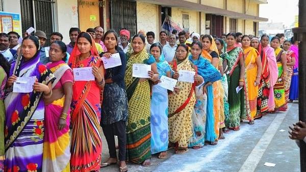 <div class="paragraphs"><p>Voters stand in a queue at a polling station to cast their votes in Raipur in 2018.</p></div>