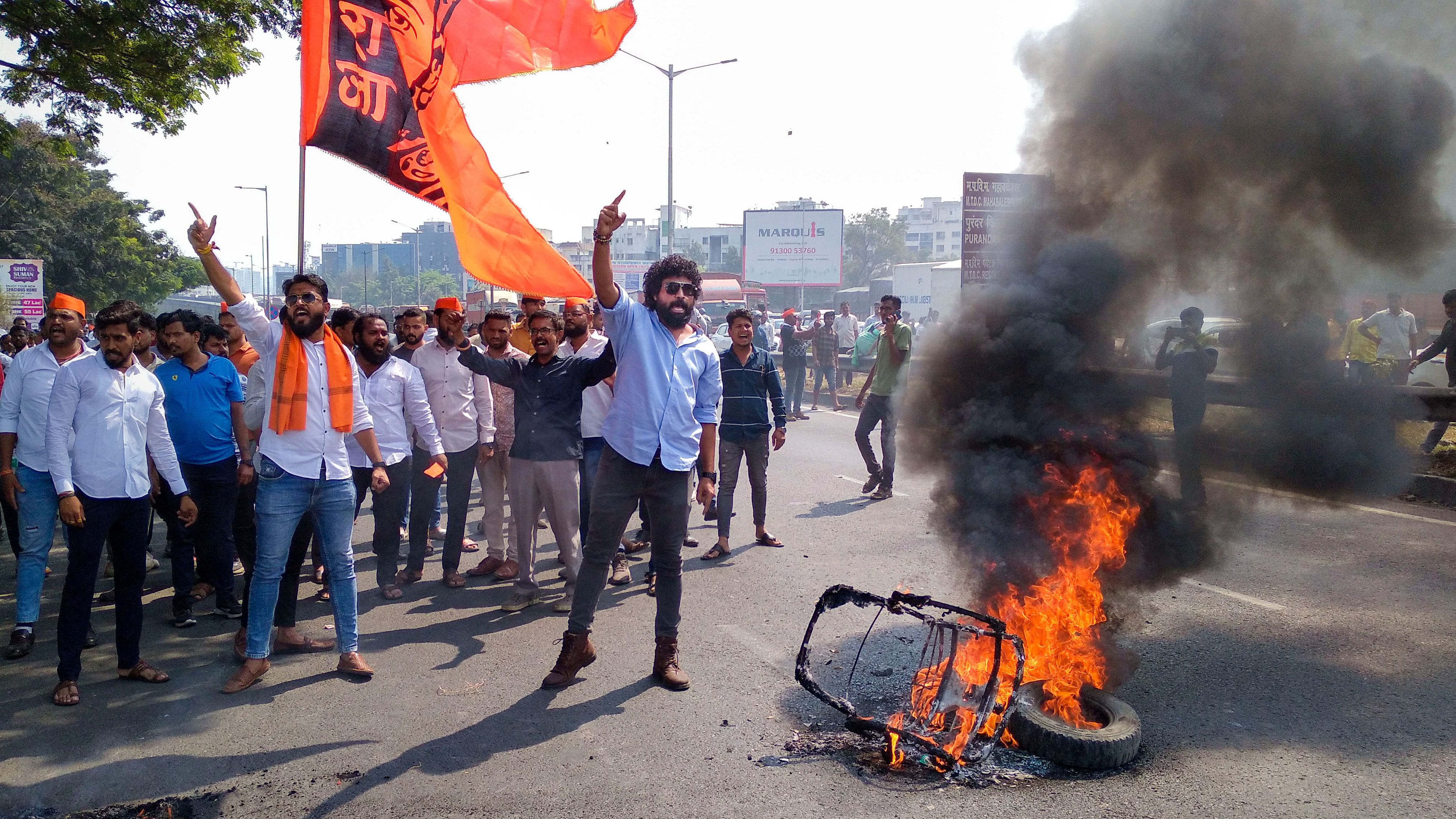 <div class="paragraphs"><p>Agitators burn tyres during a protest on Pune-Bengaluru Expressway to press for Maratha reservation, in Pune on Tuesday.  </p><p></p></div>