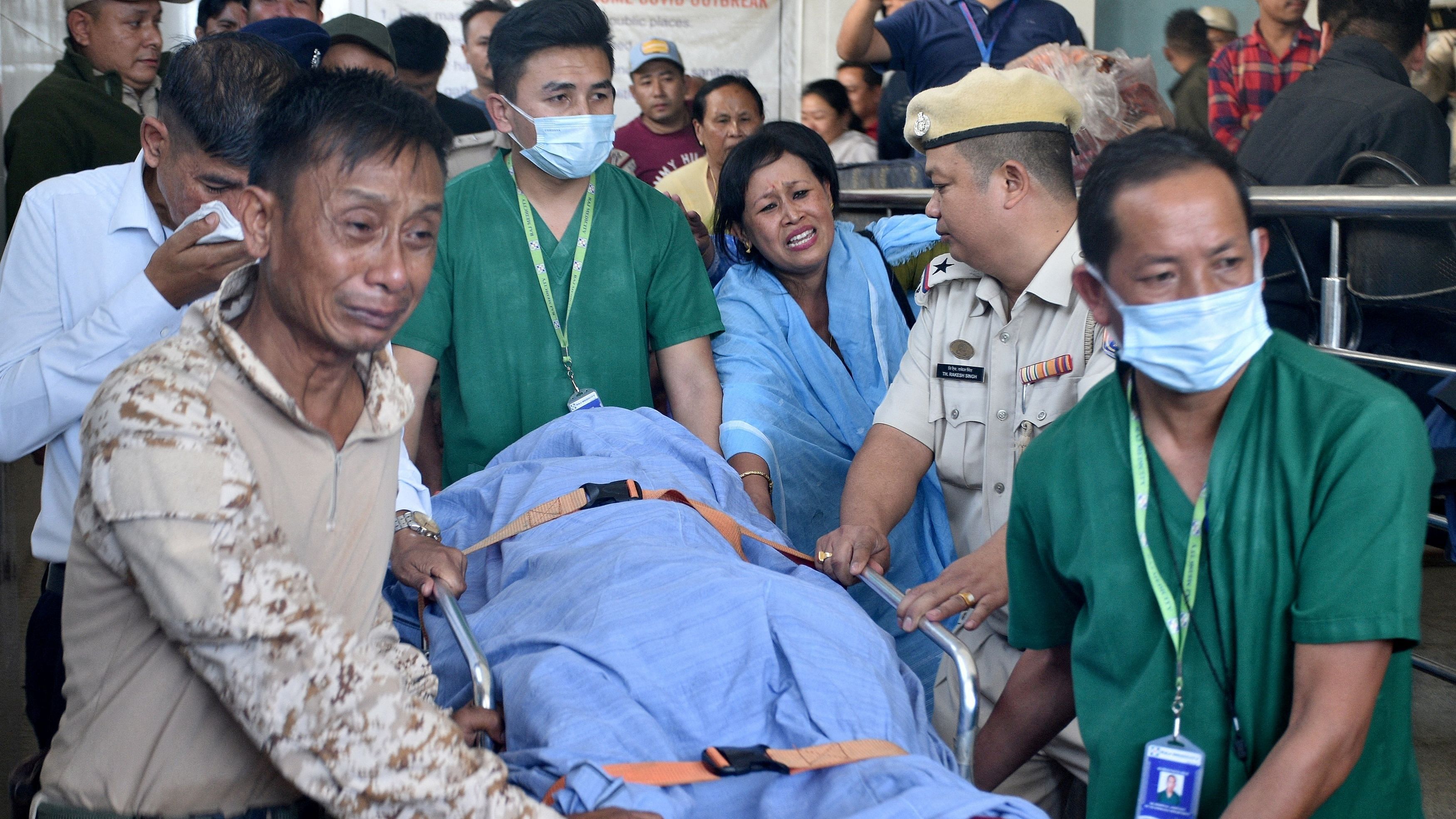 <div class="paragraphs"><p>Relatives and police officers mourn as they carry the body of Chingtham Anand, a Sub-Divisional Police Officer after he succumbed to his injuries after he was shot by suspected militants in the border town of Moreh, outside a hospital in Imphal, Manipur, India, October 31, 2023. </p></div>