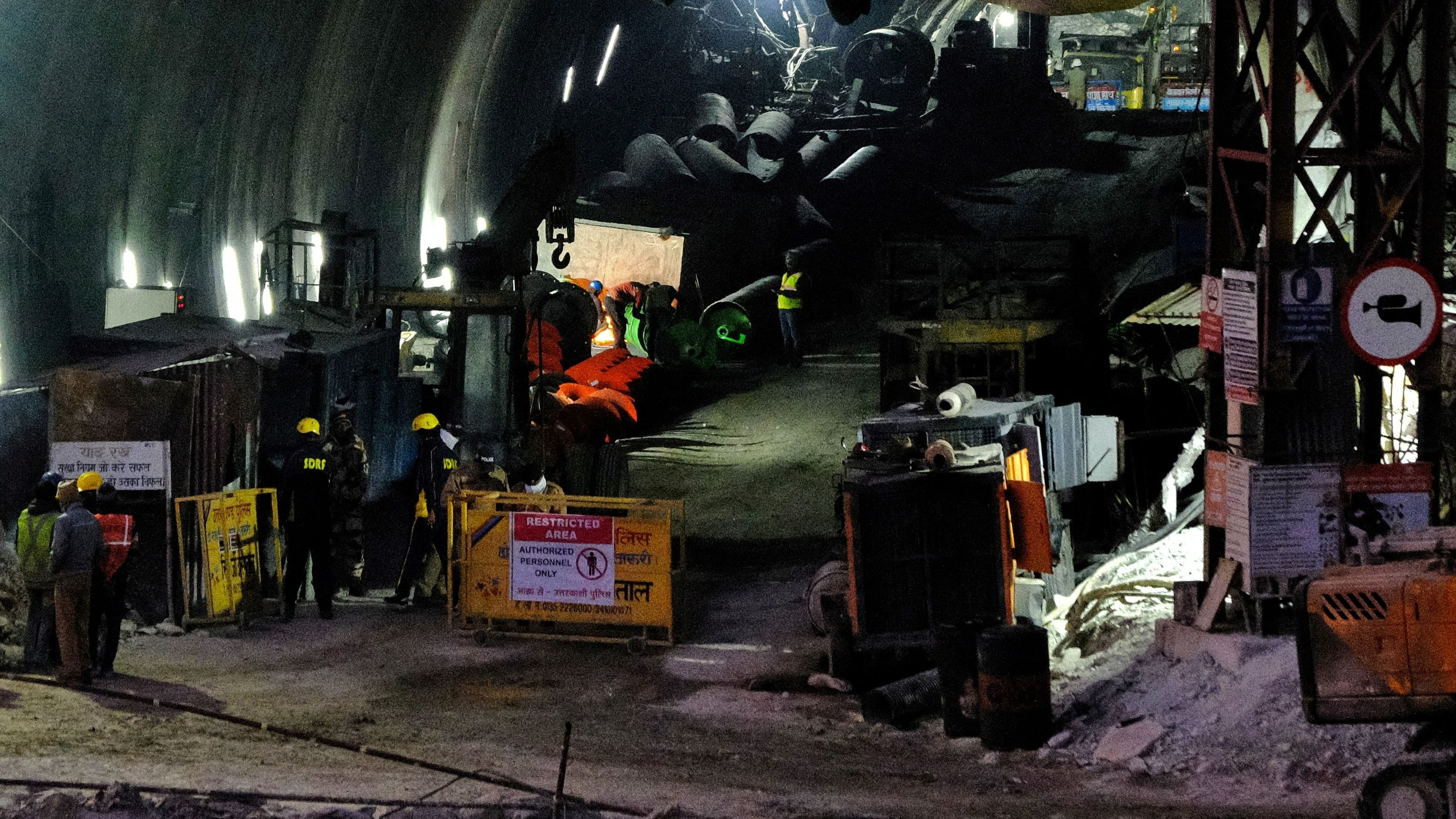 <div class="paragraphs"><p>Members of rescue teams use an auger inside a tunnel where workers have been trapped for ten days after the tunnel collapsed in Uttarkashi, in the northern state of Uttarakhand, India, November 22, 2023. </p></div>