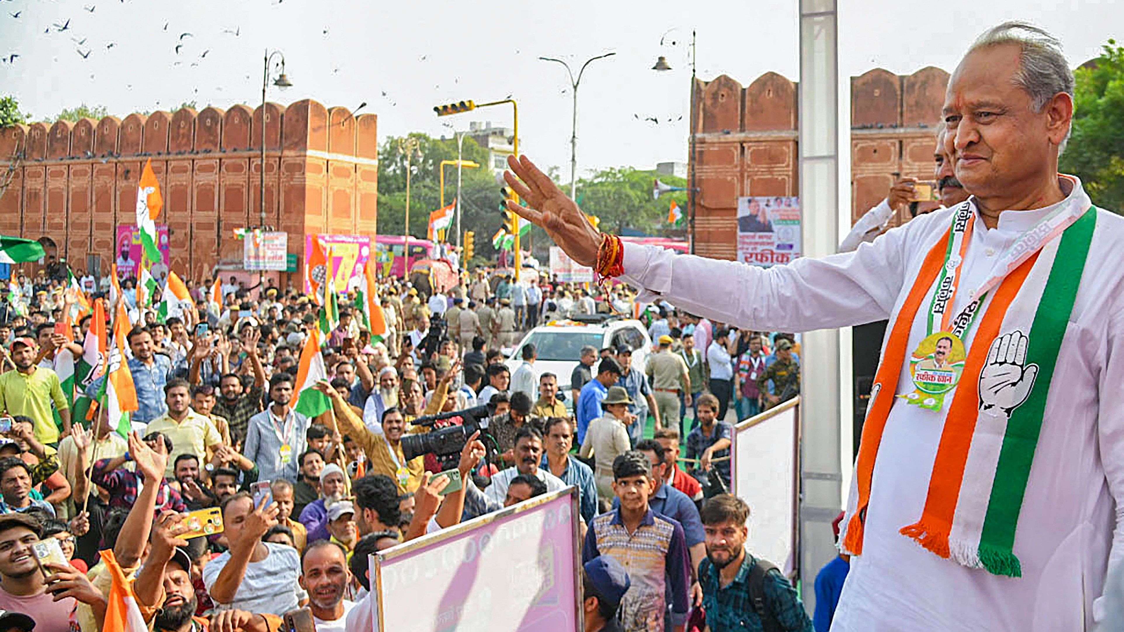 <div class="paragraphs"><p>Jaipur: Rajasthan Chief Minister Ashok Gehlot waves at supporters during the  'Congress Guarantee Yatra' ahead of Assembly polls, in Jaipur, Tuesday, Nov. 7, 2023. </p></div>