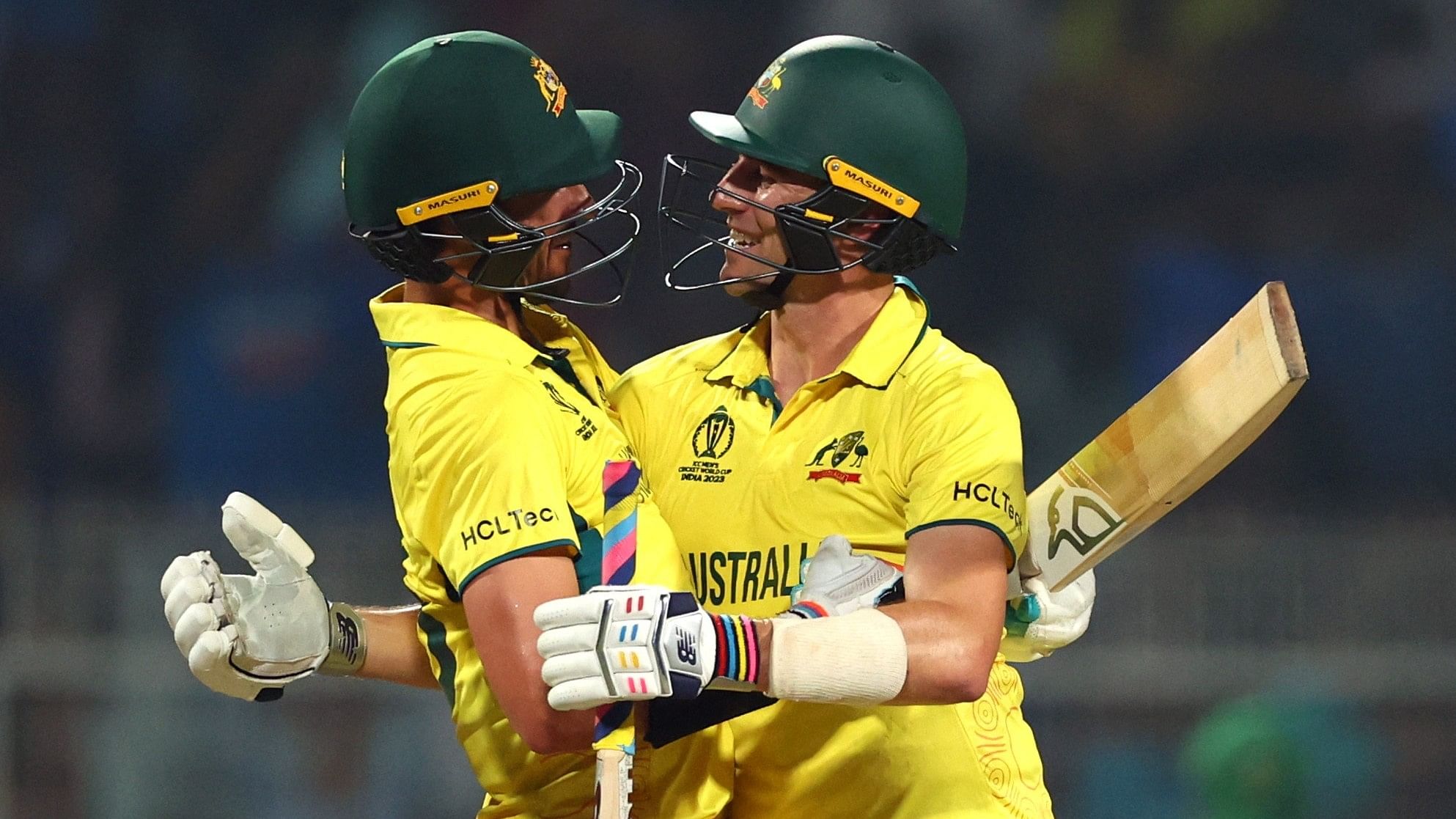 <div class="paragraphs"><p>Australia's Pat Cummins and Mitchell Starc celebrate progressing to the final after winning the match at the&nbsp;Eden Gardens, Kolkata.&nbsp;</p></div>