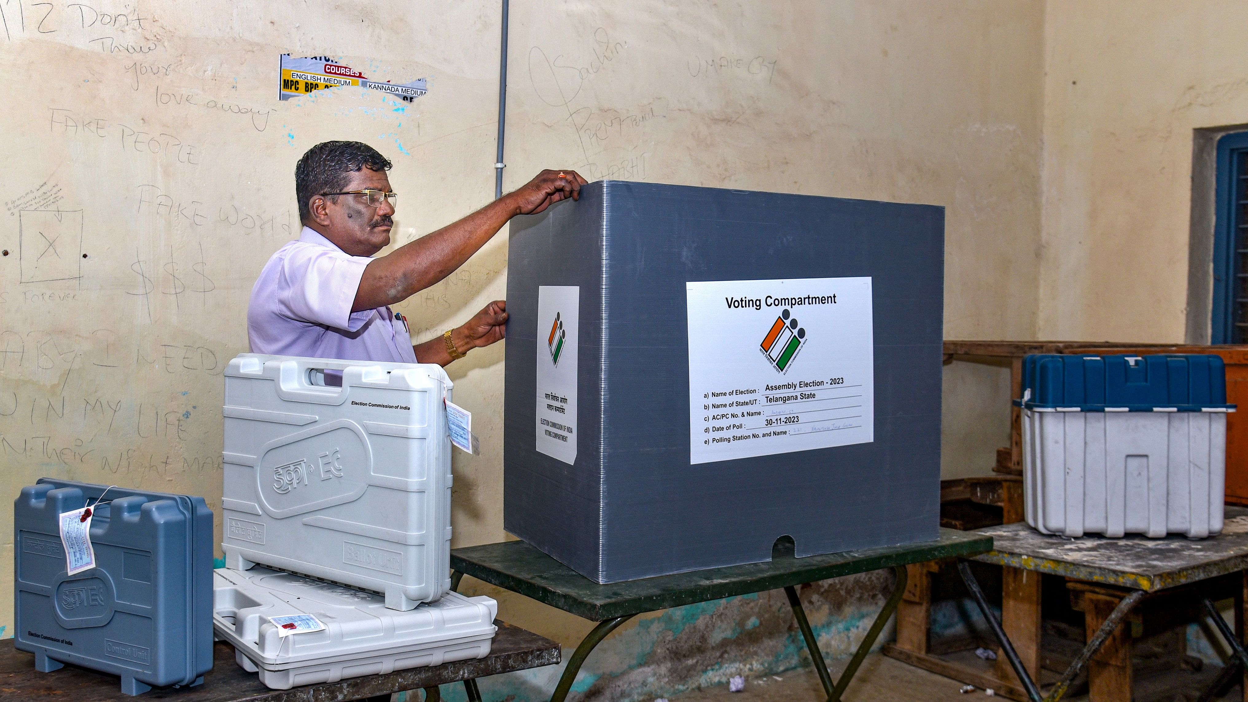 <div class="paragraphs"><p>An election official arranges equipment at a polling station on the eve of the Telangana Assembly election, in Hyderabad.&nbsp;</p></div>