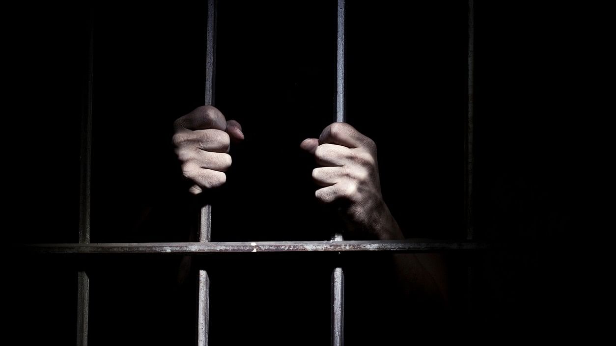 <div class="paragraphs"><p>Representative image of a man in a jail cell.</p></div>