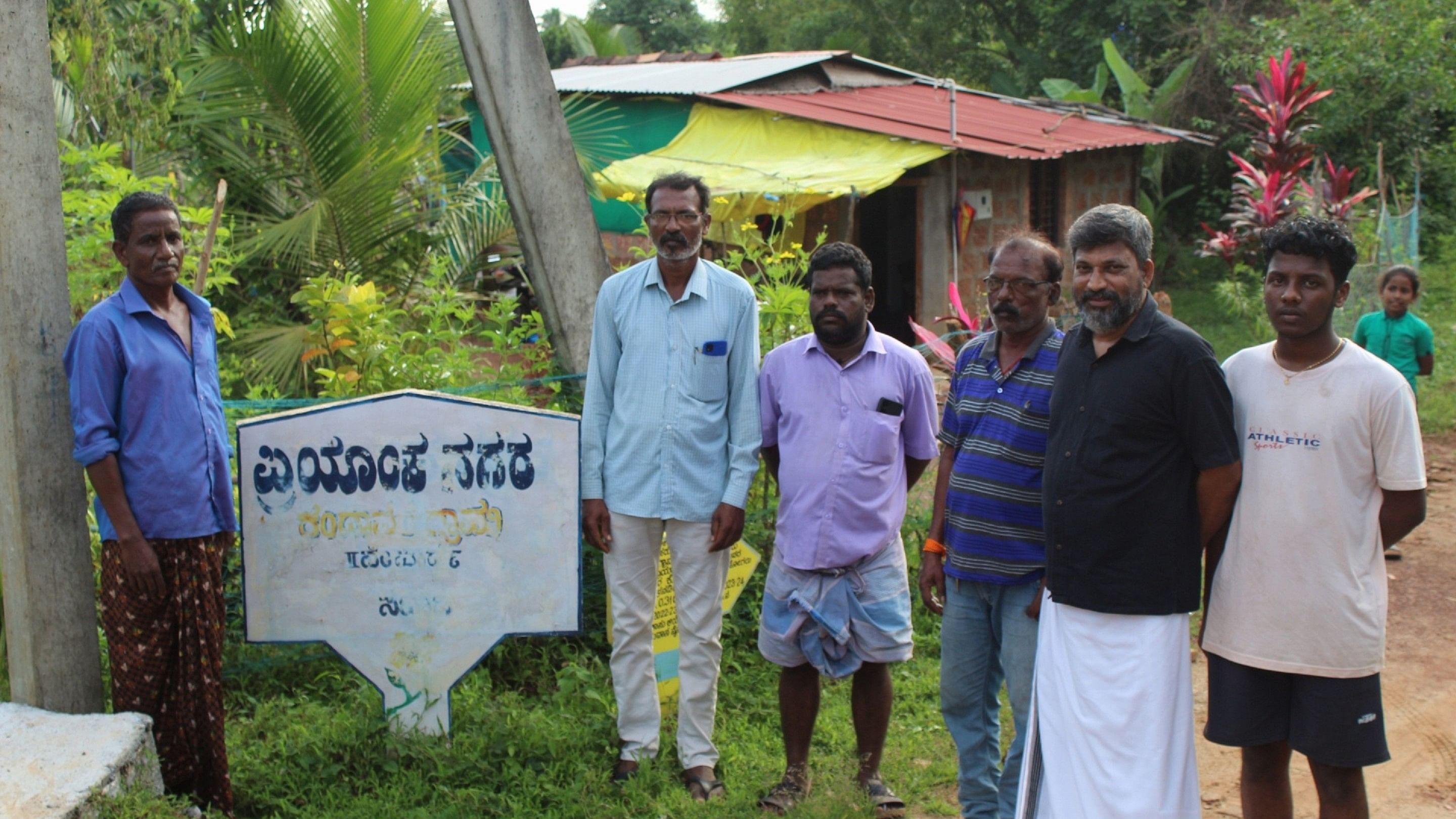 Advocate B S Kalavarkar (second from right) with the residents of Priyanka Nagar. Photo by Siddarth