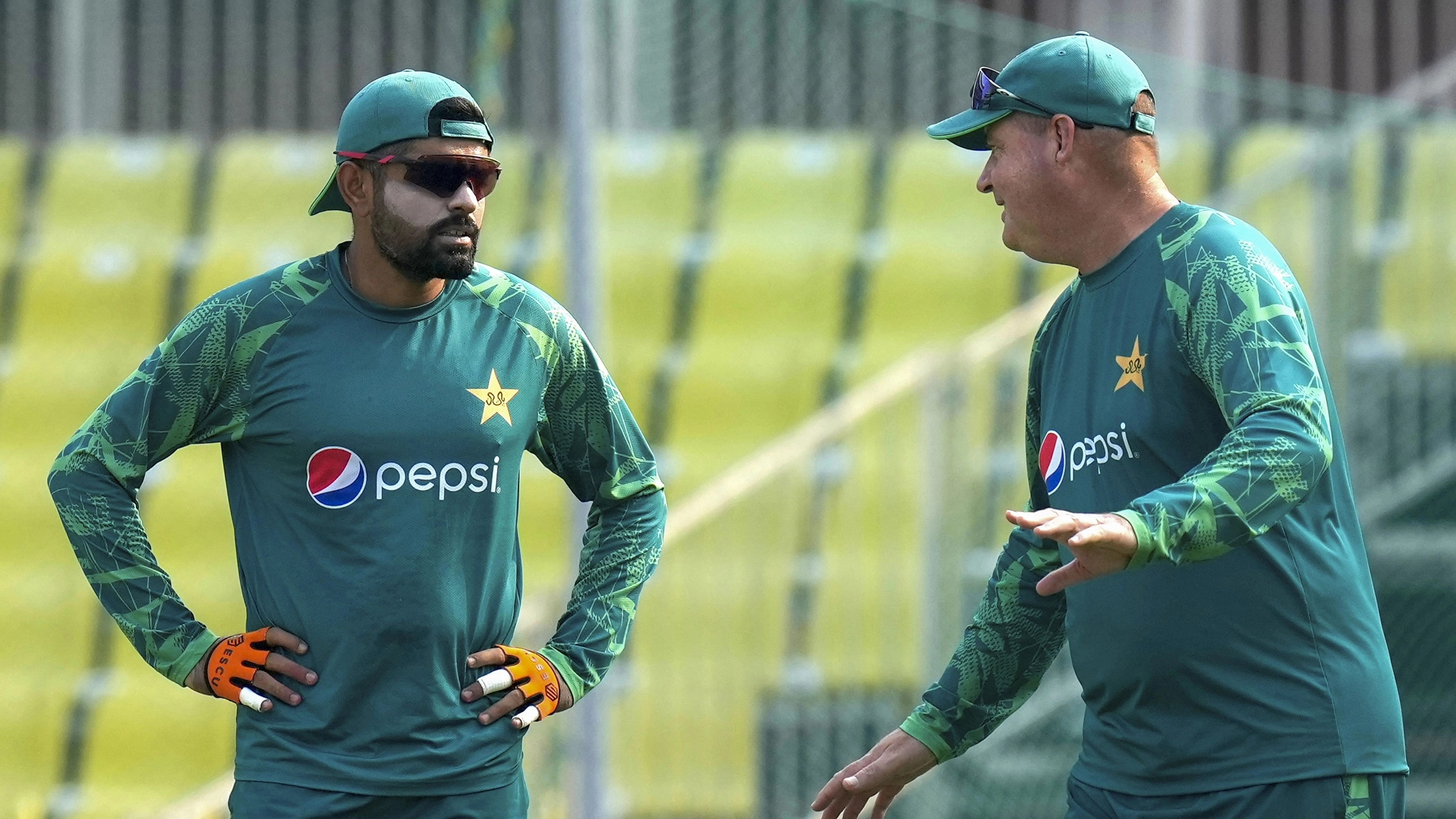 <div class="paragraphs"><p>Pakistan's captain Babar Azam with team director Mickey Arthur during a practice session.</p></div>