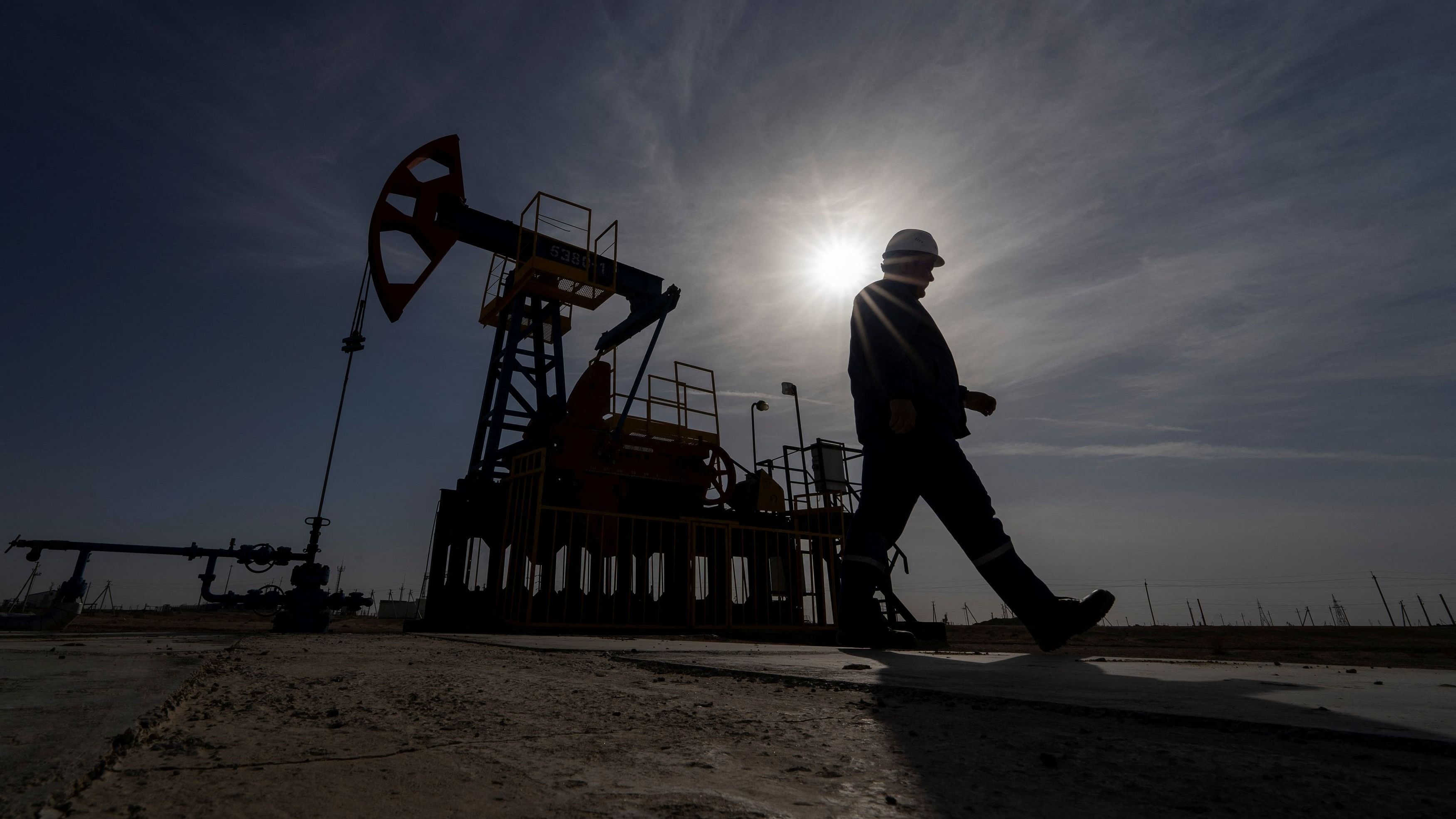 <div class="paragraphs"><p>An oil and gas industry worker walks during operations of a drilling rig at Zhetybay field in the Mangystau region, Kazakhstan.&nbsp;</p></div>