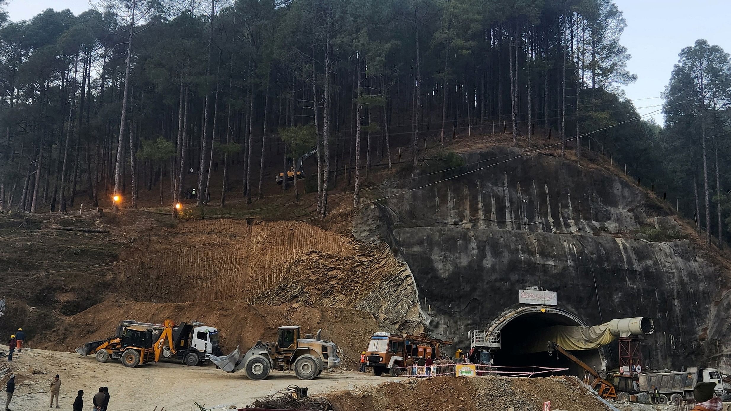 <div class="paragraphs"><p>Rescuers use a digger to make a path at the top of the mountain as part of an alternate plan to reach the workers trapped in a tunnel, in Uttarkashi.&nbsp;</p></div><div class="paragraphs"><p><strong><br></strong></p></div>